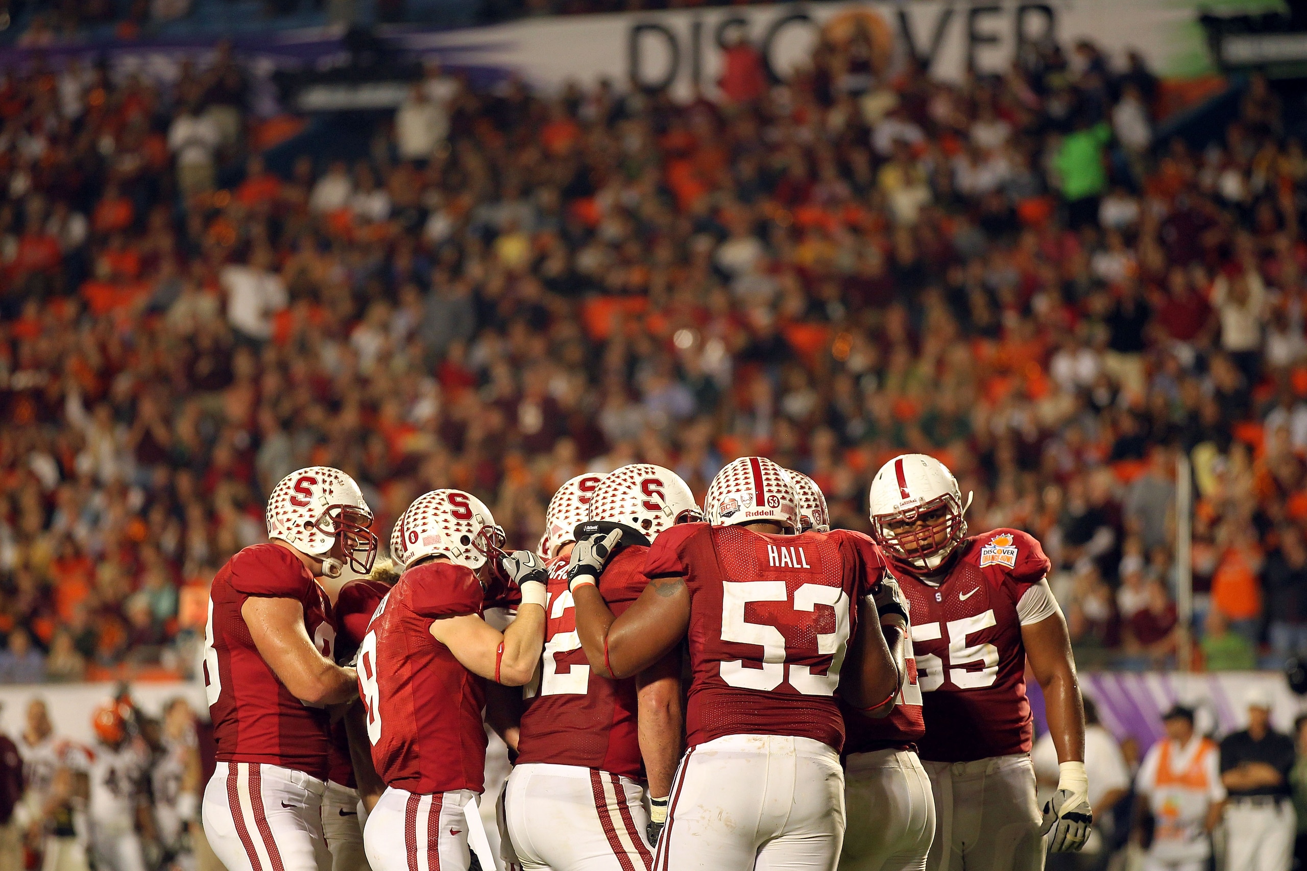 MIAMI, FL - JANUARY 03:  The Stanford Cardinal offense stands in a huddle against the Virginia Tech Hokies during the 2011 Discover Orange Bowl at Sun Life Stadium on January 3, 2011 in Miami, Florida.  (Photo by Mike Ehrmann/Getty Images)