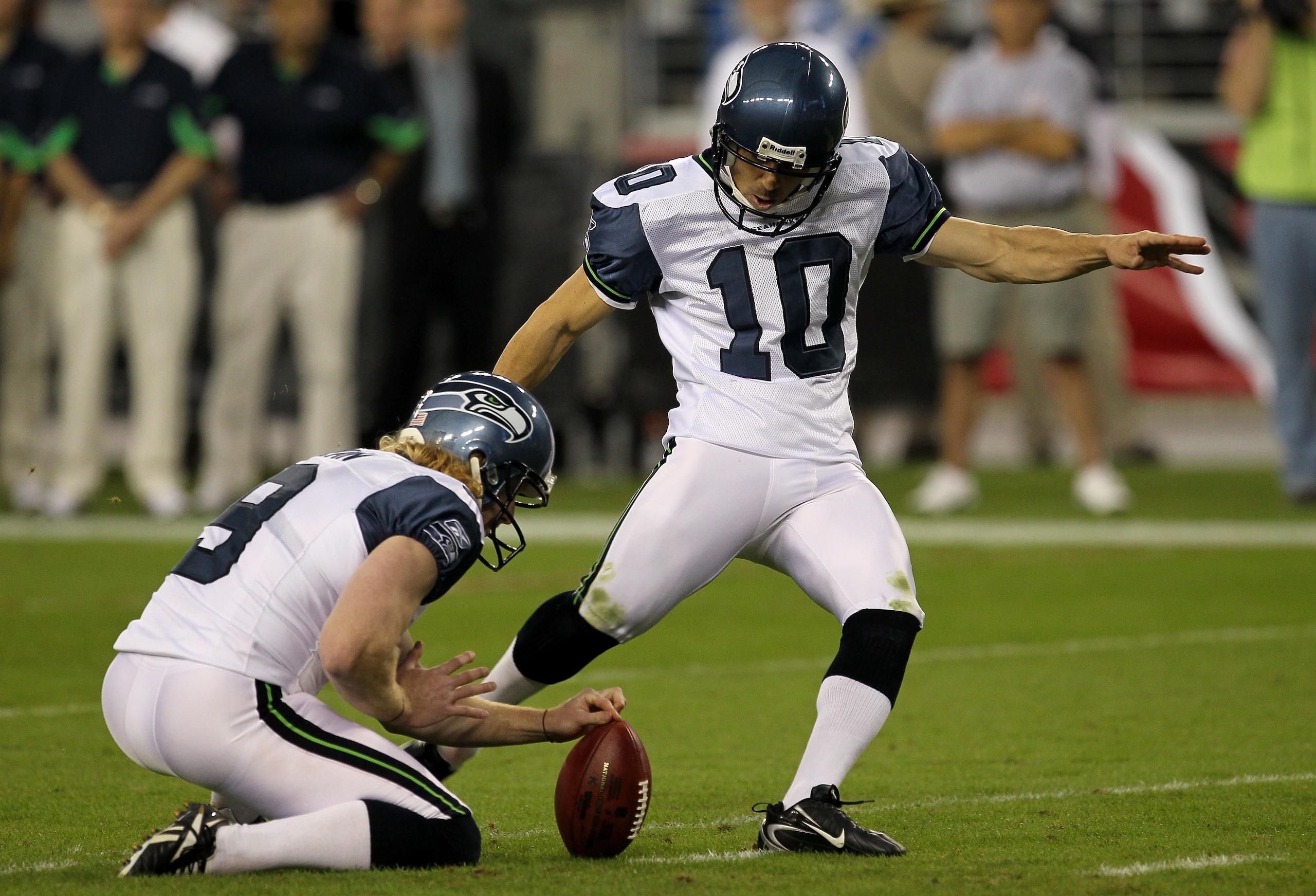 GLENDALE, AZ - NOVEMBER 14:   Kicker Olindo Mare #10 of the Seattle Seahawks kicks his fifth field goal of the game out of the hold of Jon  Ryan #9 against the Arizona Cardinals at University of Phoenix Stadium on November 14, 2010 in Glendale, Arizona. S