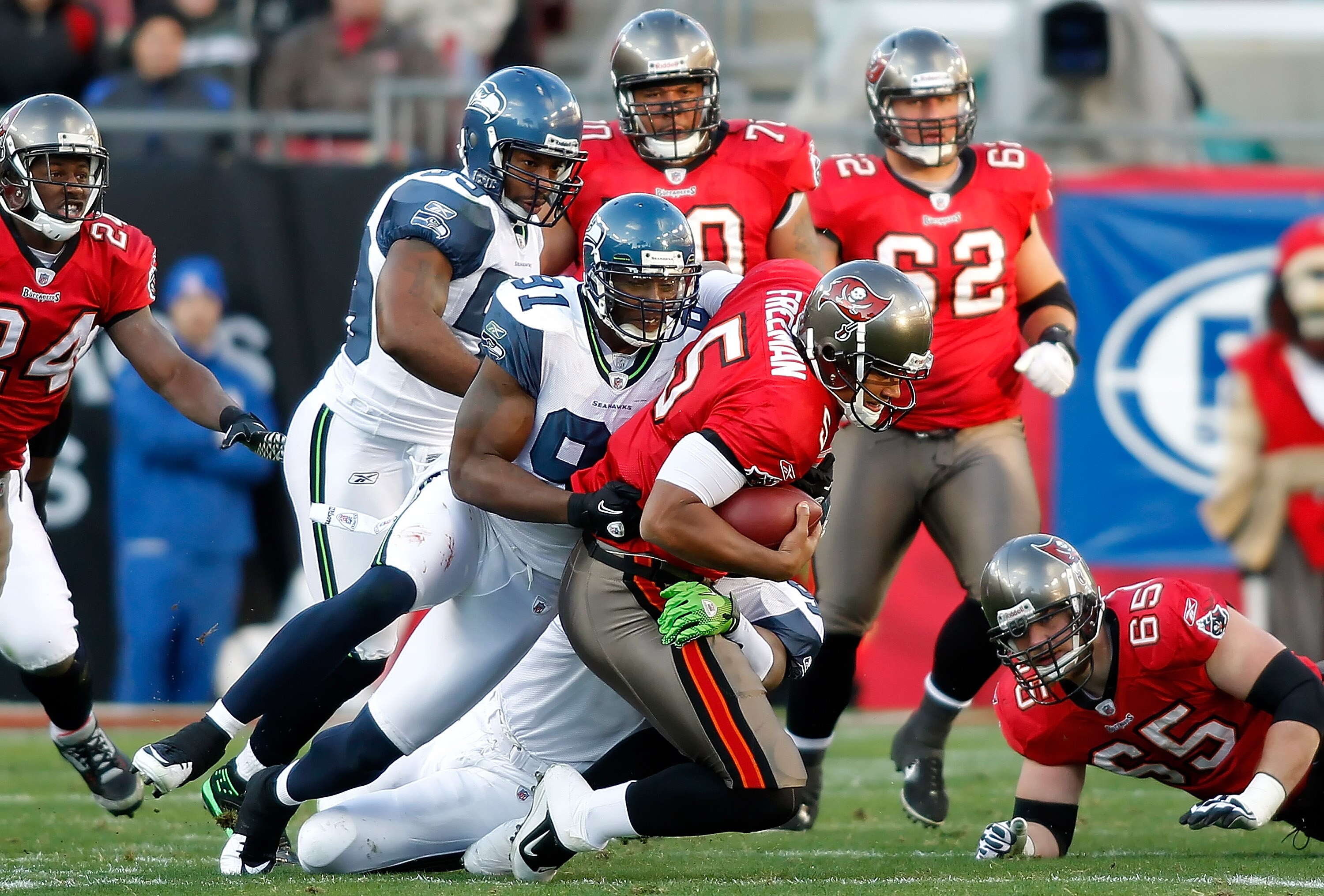 TAMPA, FL - DECEMBER 26: Defensive end Chris Clemons #91 of the Seattle Seahawks sacks quarterback Josh Freeman #5 of the Tampa Bay Buccaneers during the game at Raymond James Stadium on December 26, 2010 in Tampa, Florida. (Photo by J. Meric/Getty Images