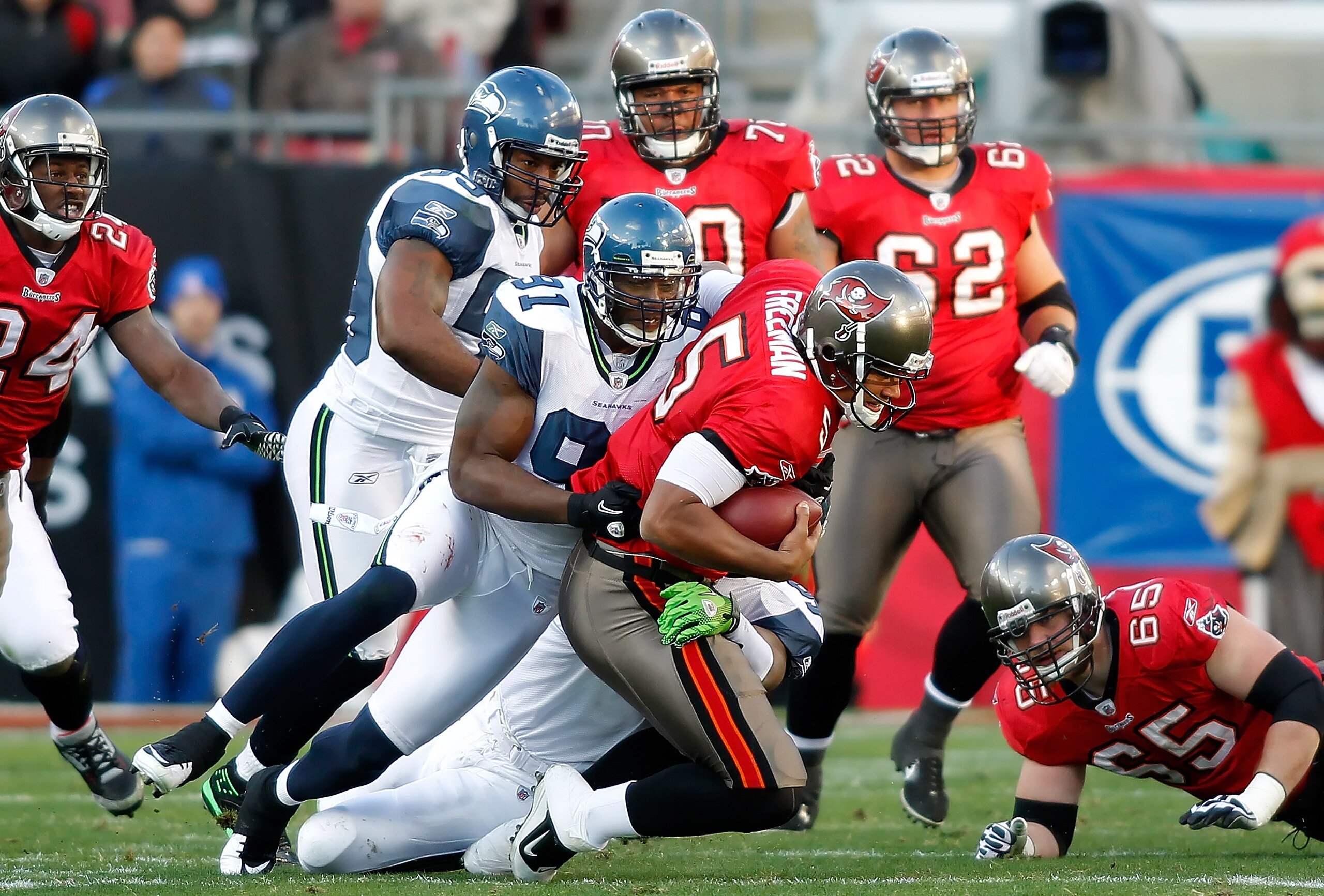 TAMPA, FL - DECEMBER 26: Defensive end Chris Clemons #91 of the Seattle Seahawks sacks quarterback Josh Freeman #5 of the Tampa Bay Buccaneers during the game at Raymond James Stadium on December 26, 2010 in Tampa, Florida. (Photo by J. Meric/Getty Images