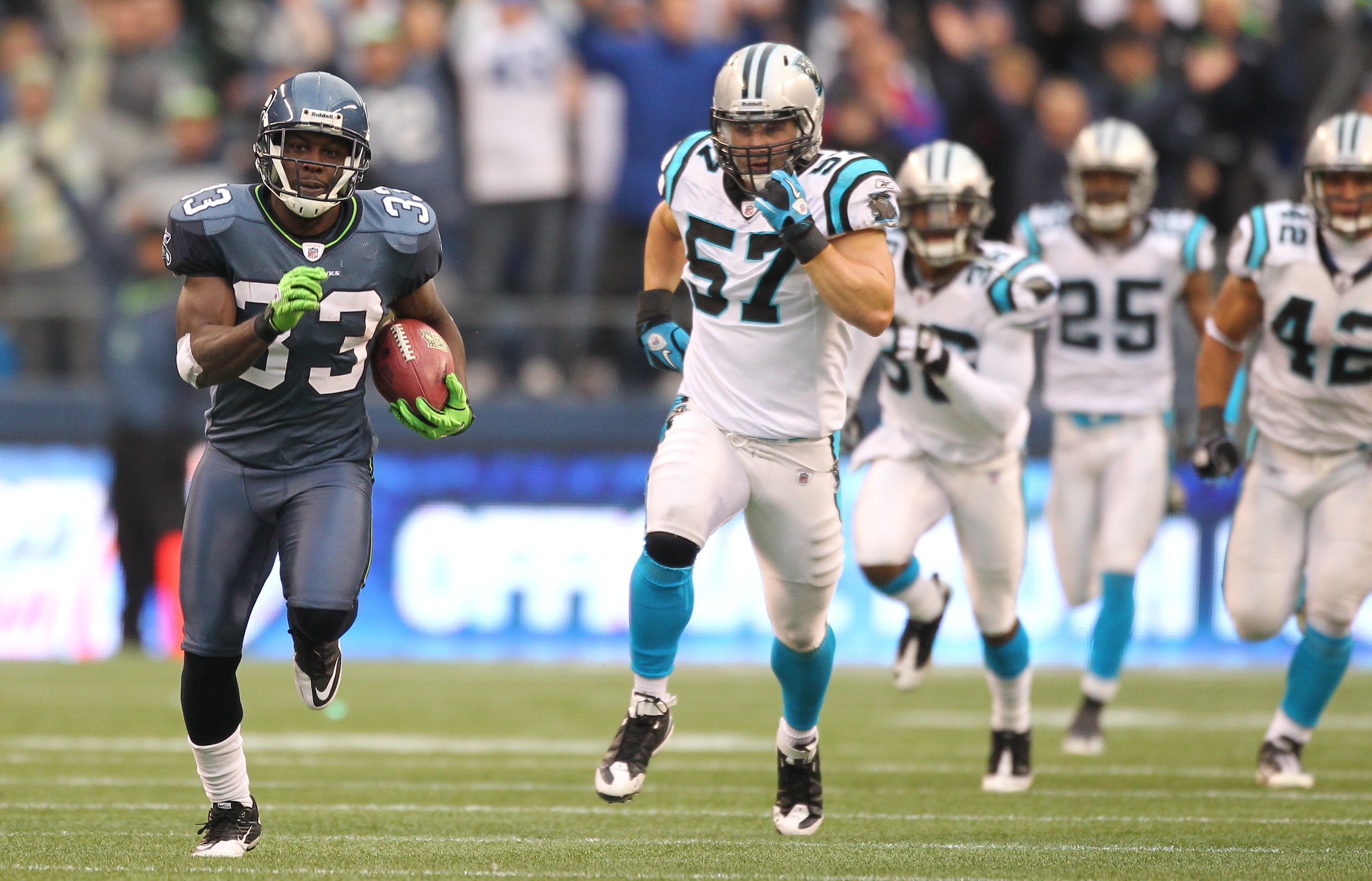 SEATTLE - DECEMBER 05:  Running back Leon Washington #33 of the Seattle Seahawks returns a punt for 84 yards against the Carolina Panthers at Qwest Field on December 5, 2010 in Seattle, Washington. Washington was down at the 2 yard line on the play, and t