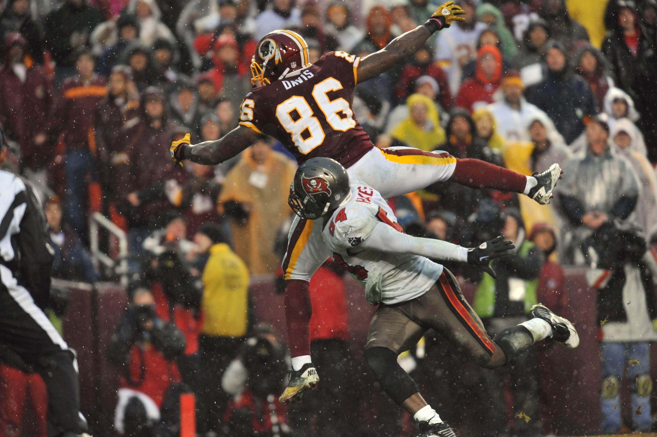 LANDOVER, MD - DECEMBER 12:  Fred Davis #86 of the Washington Redskins can't make this endzone catch with less than a minute remaining while Geno Hayes #54 of the Tampa Bay Buccaneers  defends at FedExField on December 12, 2010 in Landover, Maryland. The
