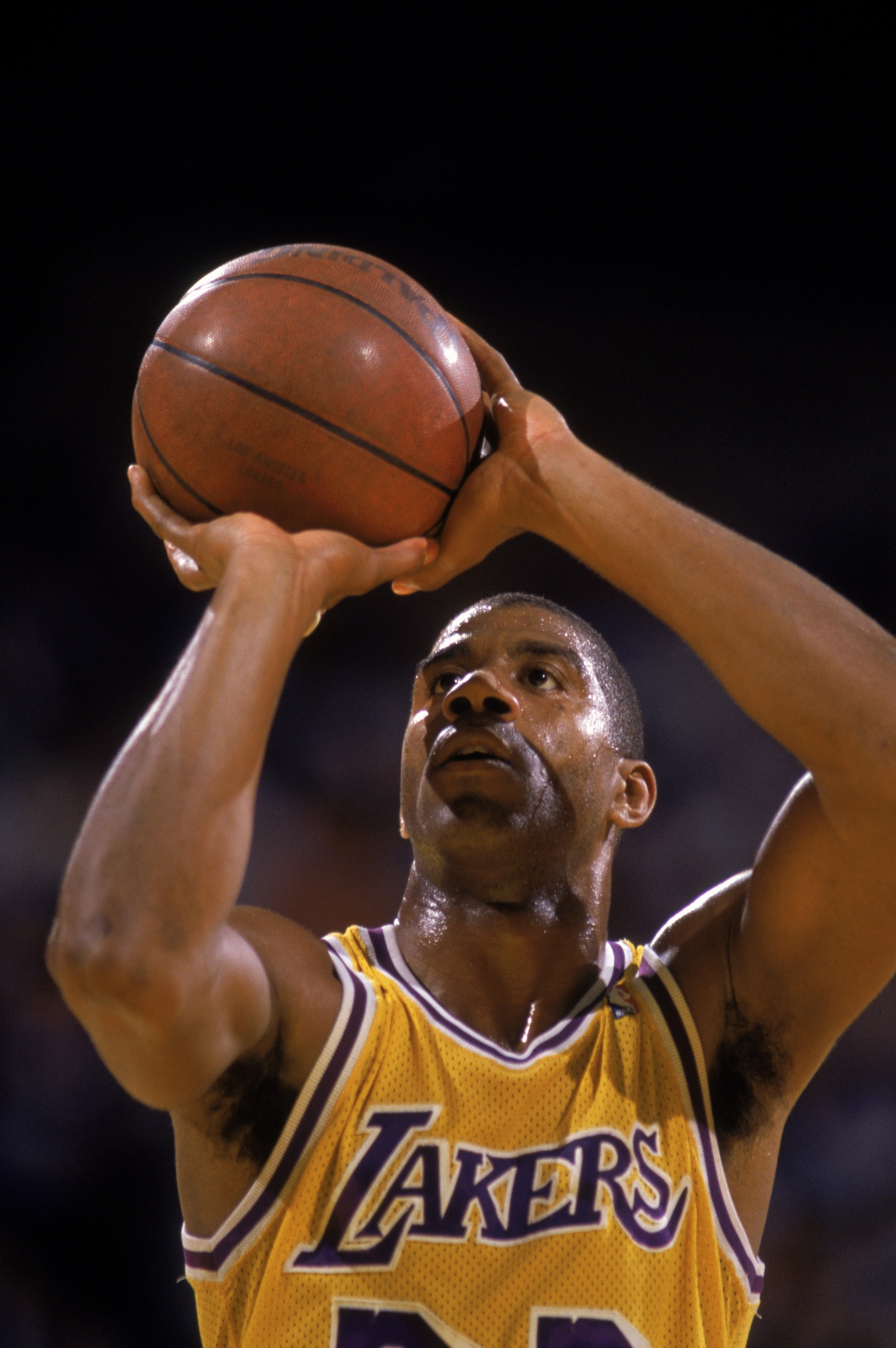 LOS ANGELES - 1988:  Magic Johnson #32 of the Los Angeles Lakers shoots a free throw during an NBA game at the Great Western Forum in Los Angeles, California in 1988. (Photo by: Mike Powell/Getty Images)