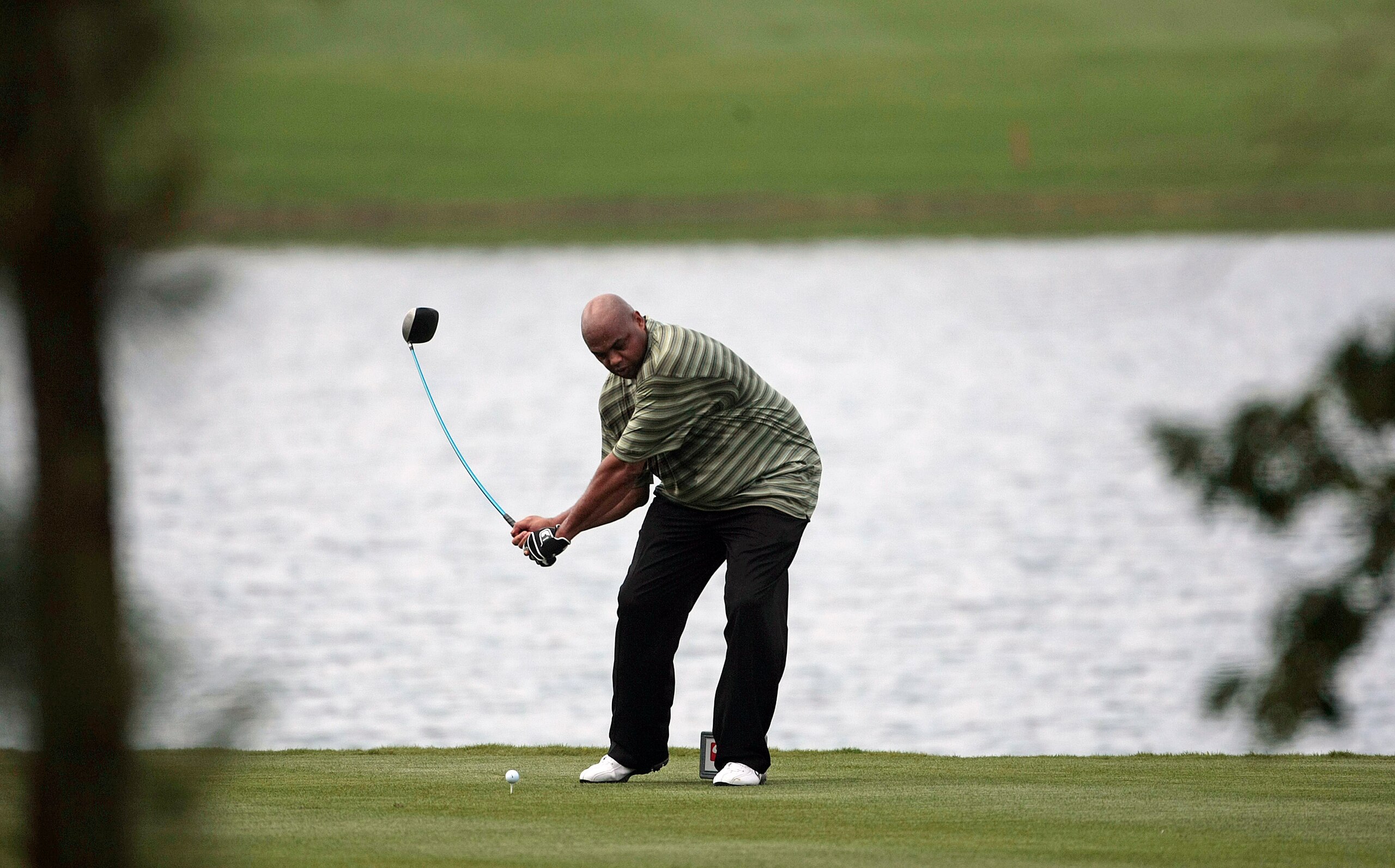 BIRMINGHAM, AL - MAY 14: Former basketball star Charles Barkley tees off on the fifth hole during the Thursday Pro-AM of the Regions Charity Classic at the Robert Trent Jones Golf Trail at Ross Bridge on May 14, 2009  in Birmingham, Alabama. (Photo by Dav