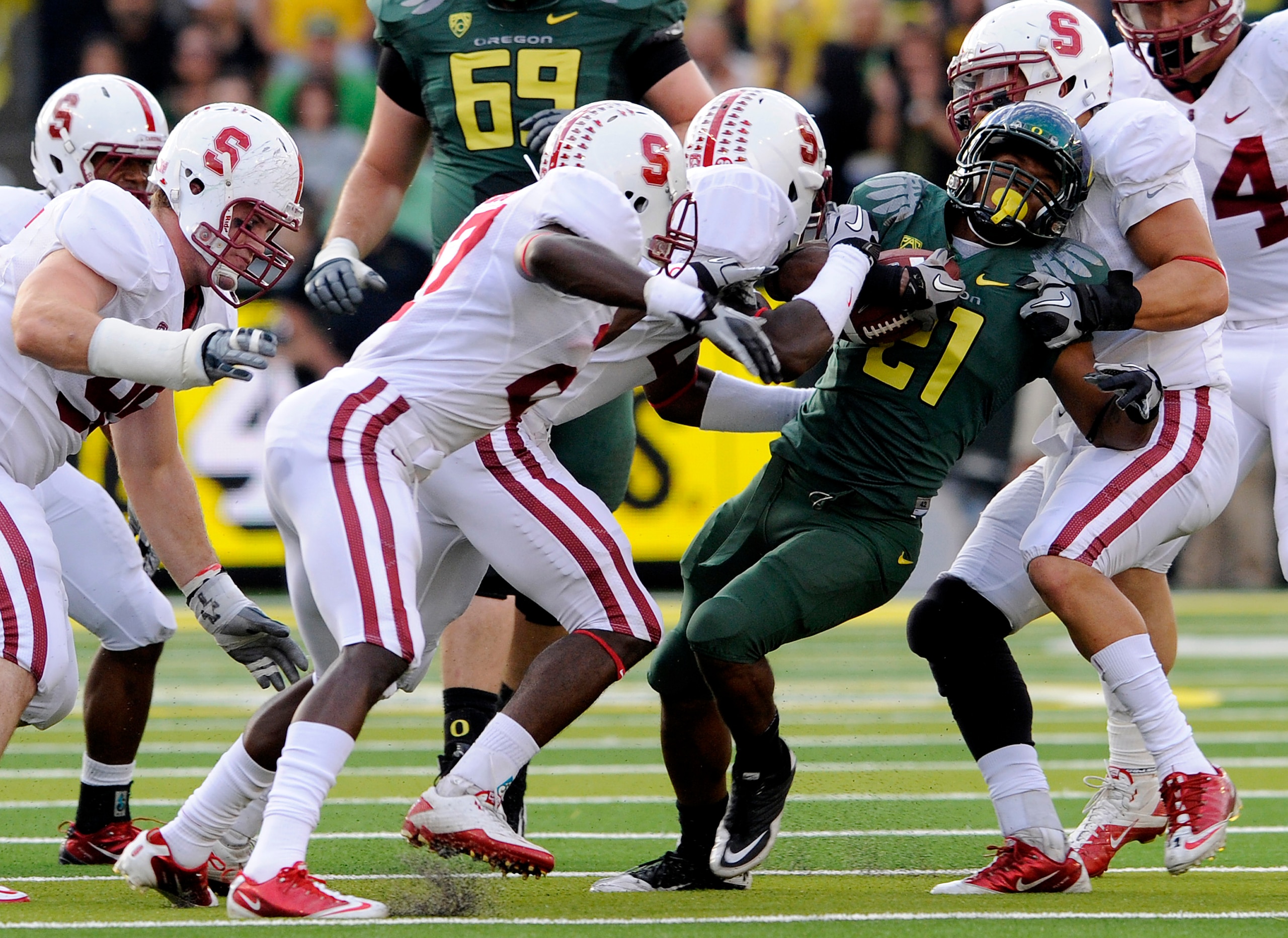 EUGENE, OR - OCTOBER 2: Stanford Cardinal defenders struggle to bring down running back LaMichael James #21 of the Oregon Ducks celebrates as he scores a touchdown in the second quarter of the game against the Stanford Cardinal at Autzen Stadium on Octobe