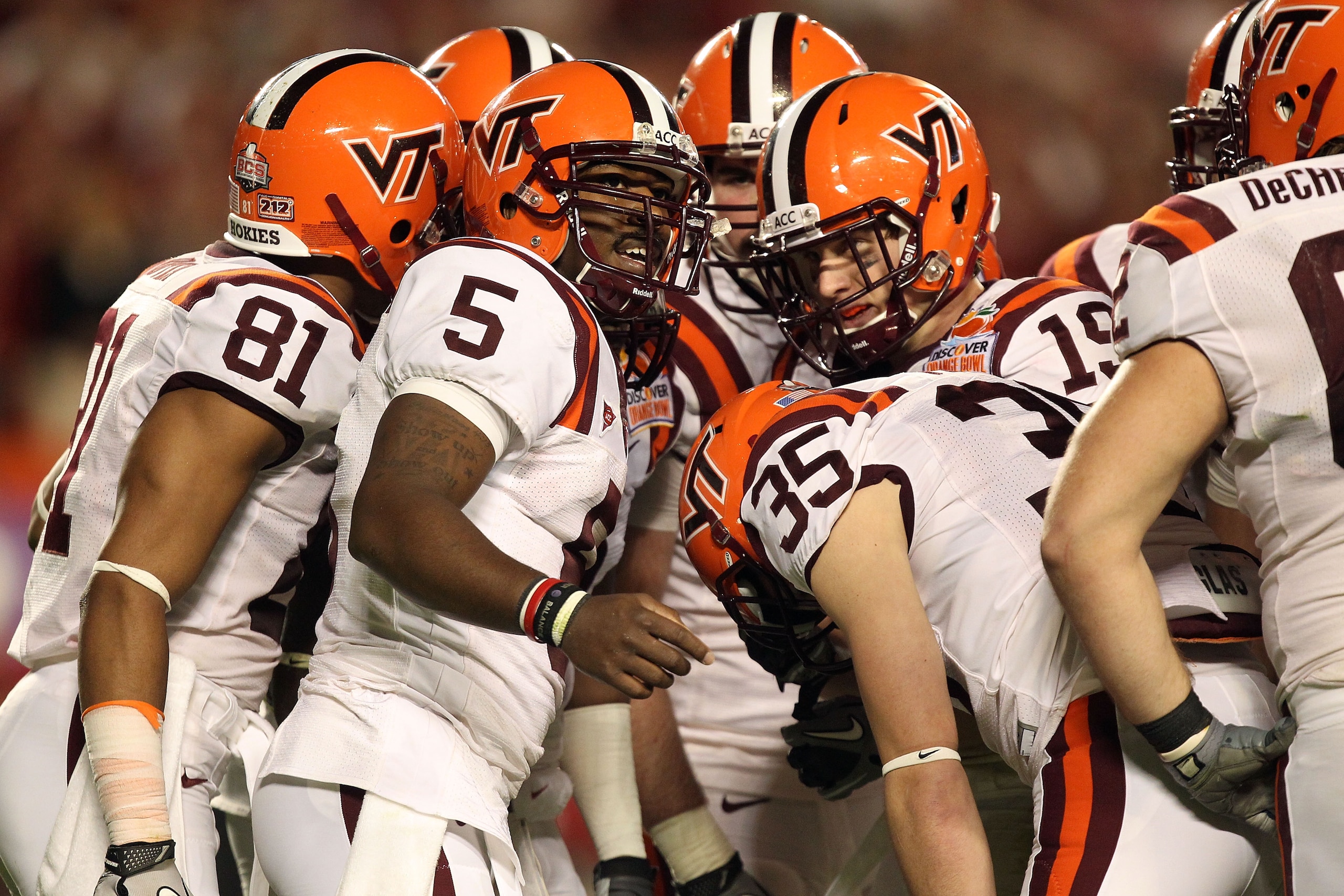 MIAMI, FL - JANUARY 03: Tyrod Taylor #5 of the Virginia Tech Hokies calls a play in the huddle against the Stanford Cardinal during the 2011 Discover Orange Bowl at Sun Life Stadium on January 3, 2011 in Miami, Florida. (Photo by Streeter Lecka/Getty Imag