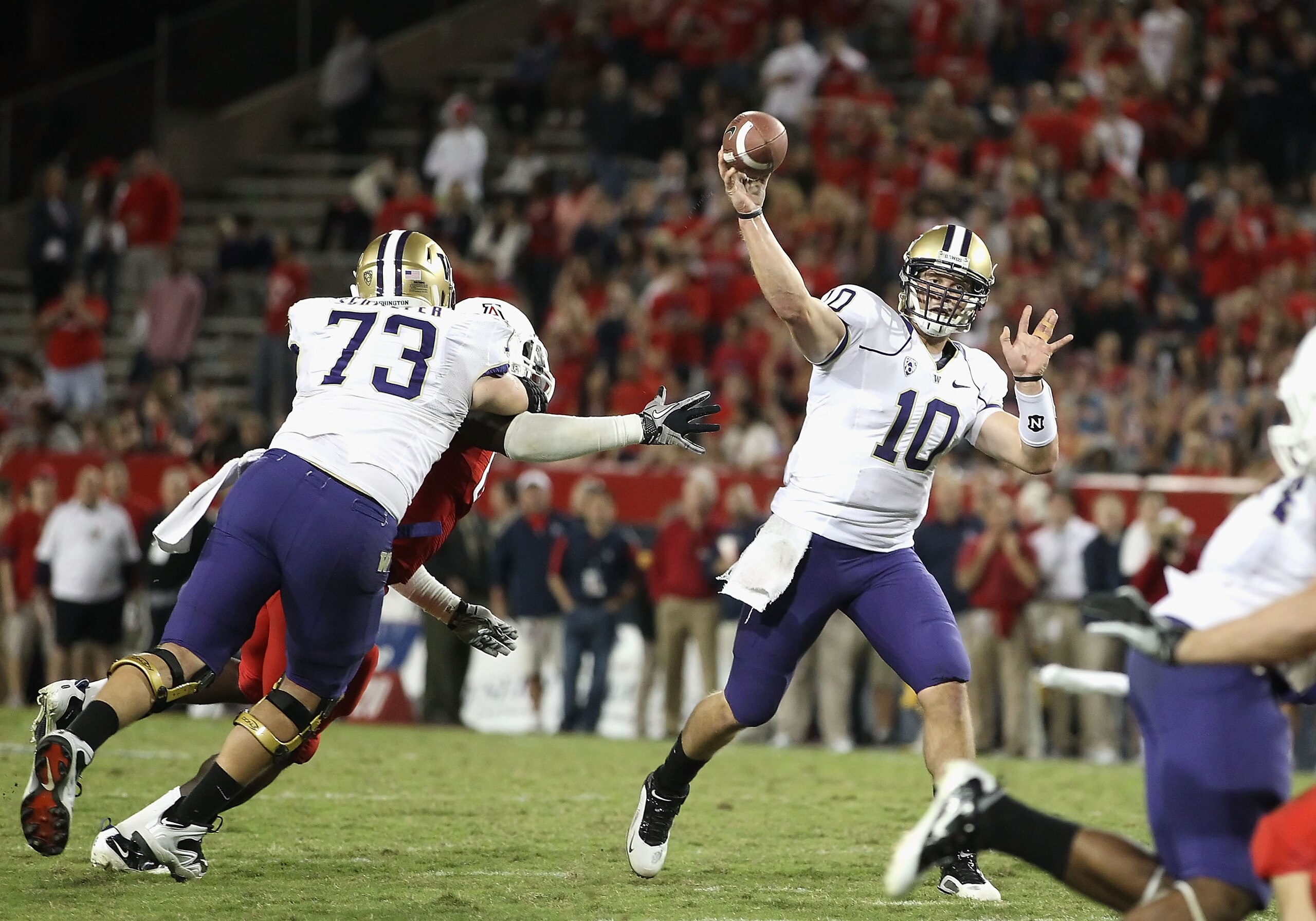 TUCSON, AZ - OCTOBER 23:  Quarterback Jake Locker #10 of the Washington Huskies drops back to pass during the college football game against the Arizona Wildcats at Arizona Stadium on October 23, 2010 in Tucson, Arizona. The Wildcats defeated the Huskies 4
