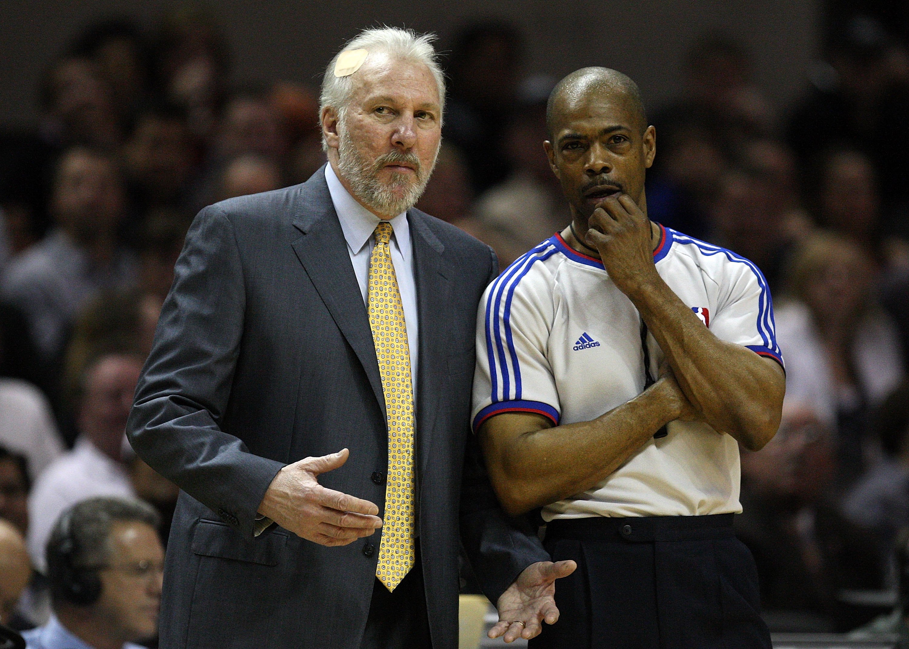 SAN ANTONIO - JANUARY 31:  NBA referee Tom Washington with Gregg Popovich of the San Antonio Spurs on January 31, 2009 at AT&T Center in San Antonio, Texas.  NOTE TO USER: User expressly acknowledges and agrees that, by downloading and/or using this Photo