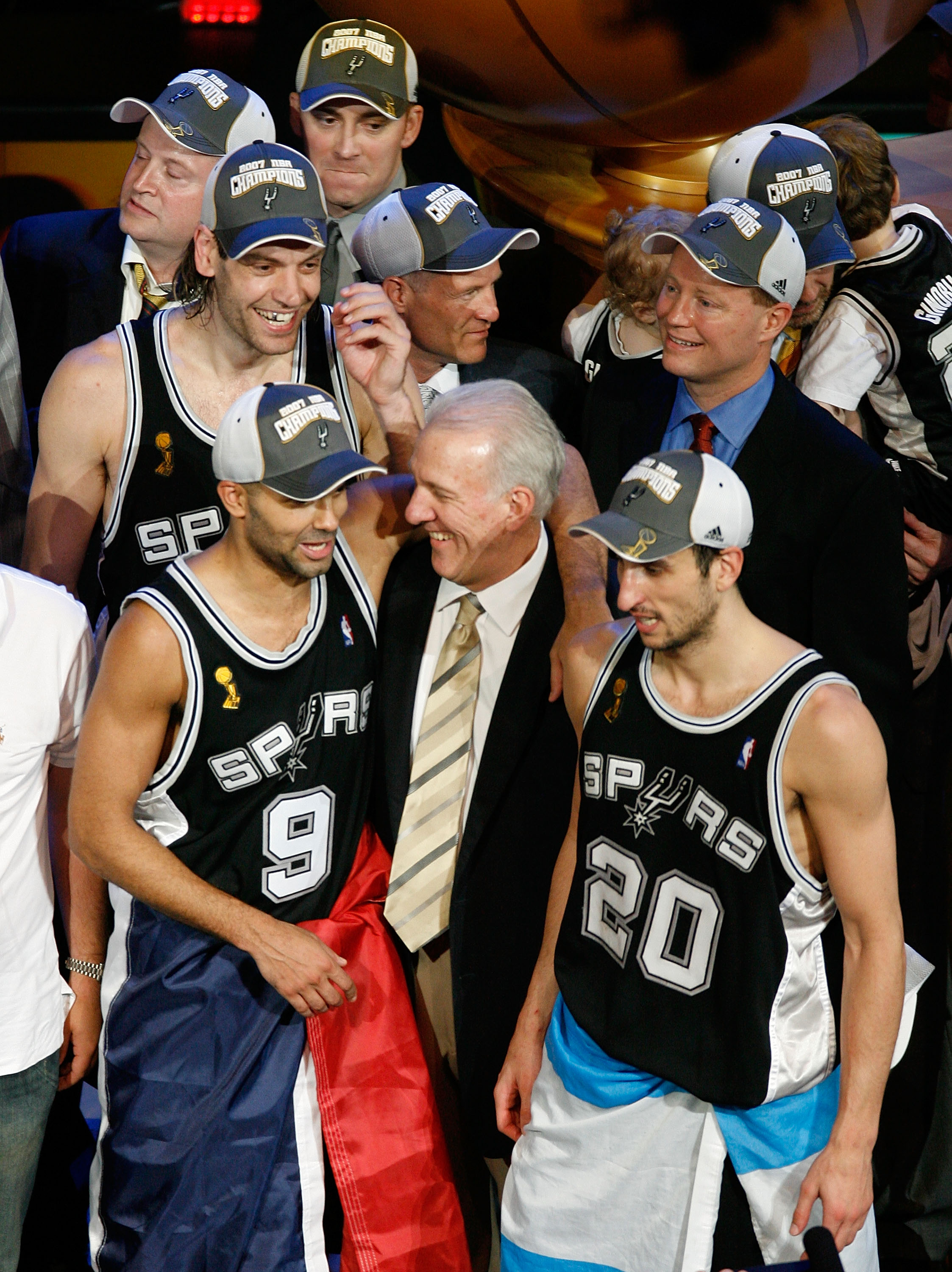 CLEVELAND - JUNE 14:  Head coach Gregg Popovich of the San Antonio Spurs celebrate with Tony Parker #9 and Manu Ginobili #20 celebrate their 83-82 victory over the Cleveland Cavaliers to win Game Four and sweep the NBA Finals on June 14, 2007 at the Quick