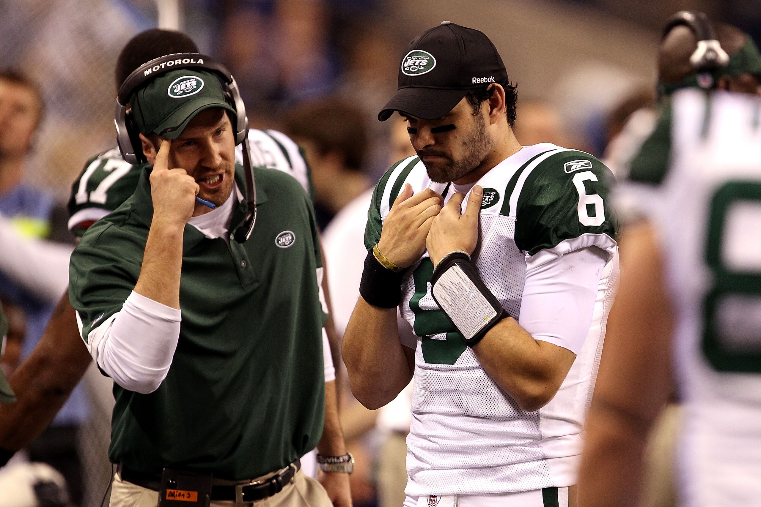 INDIANAPOLIS, IN - JANUARY 08:  Offensive coordinator Brian Schottenheimer of the New York Jets gestures as he talks to quarterback Mark Sanchez #6 late in the fourth quarter against the Indianapolis Colts during their 2011 AFC wild card playoff game at L