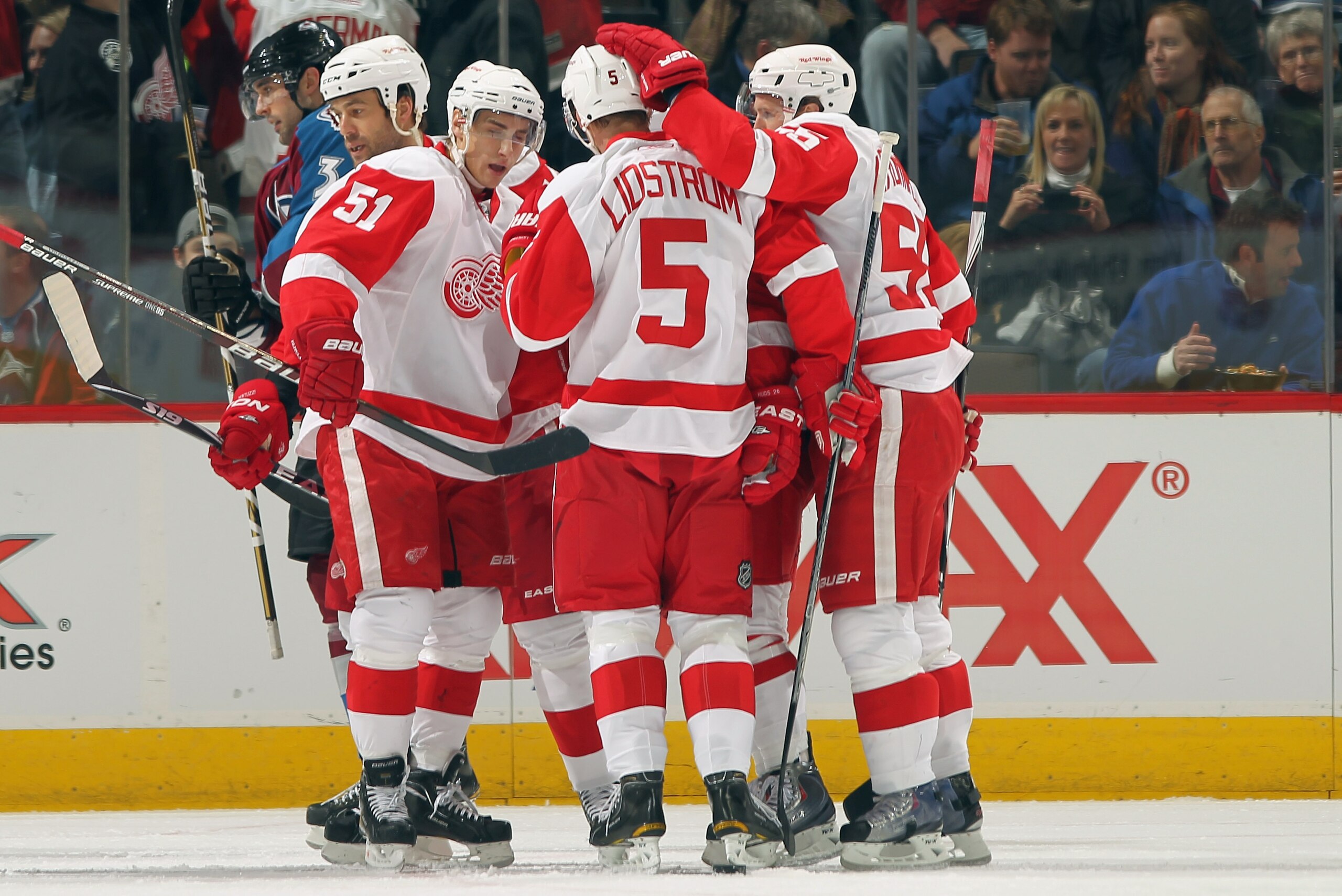 DENVER - DECEMBER 27:  Valtteri Filppula #51, Nicklas Lidstrom #5, Jonathan Kronwall #55 and Todd Bertuzzi #44 of the Detroit Red Wings celebrate their first period power play goal by Jiri Hudler #26 against the Colorado Avalanche at the Pepsi Center on D