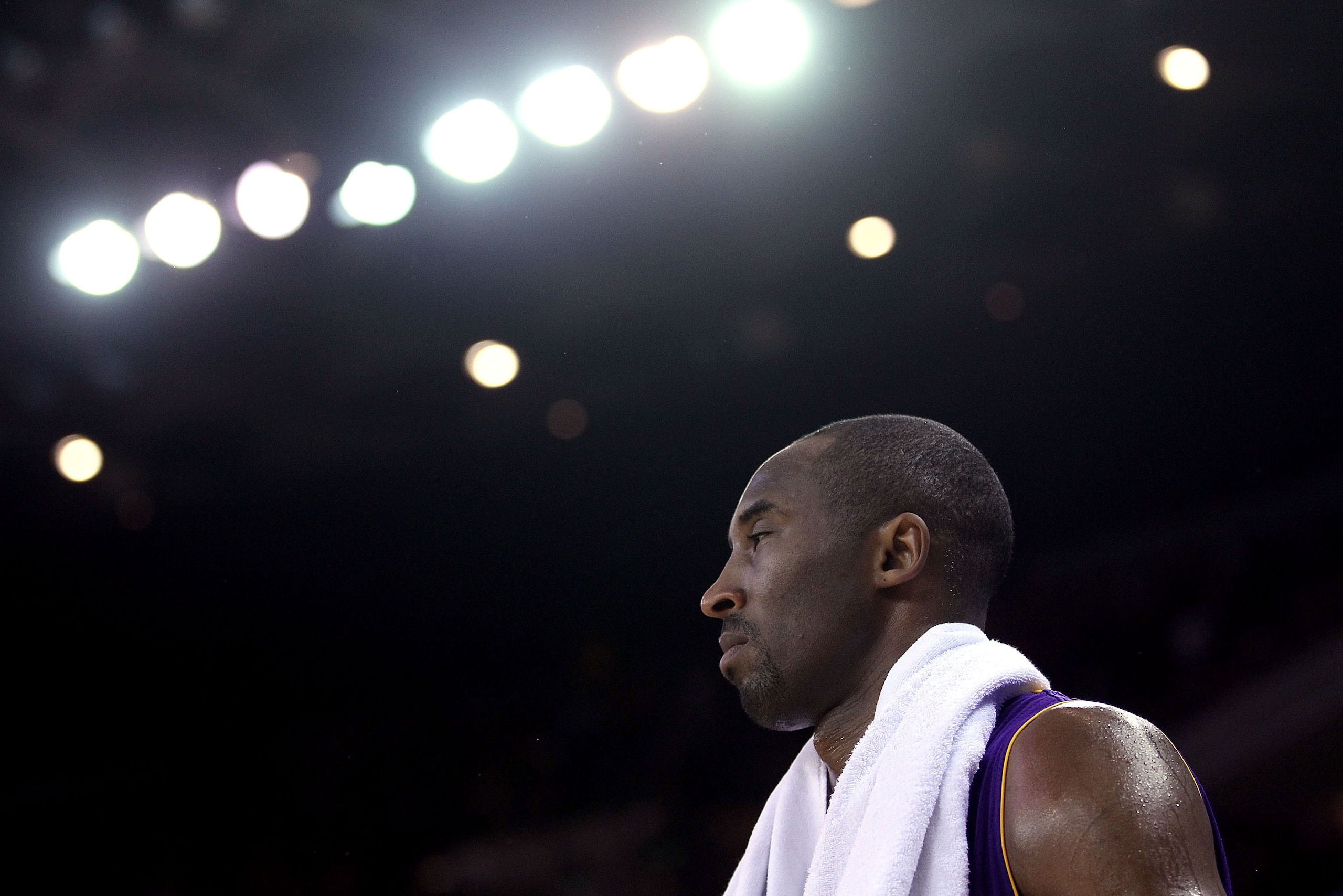 OAKLAND, CA - JANUARY 12:  Kobe Bryant #24 of the Los Angeles Lakers stands by the bench during their game against the Golden State Warriors at Oracle Arena on January 12, 2011 in Oakland, California. NOTE TO USER: User expressly acknowledges and agrees t