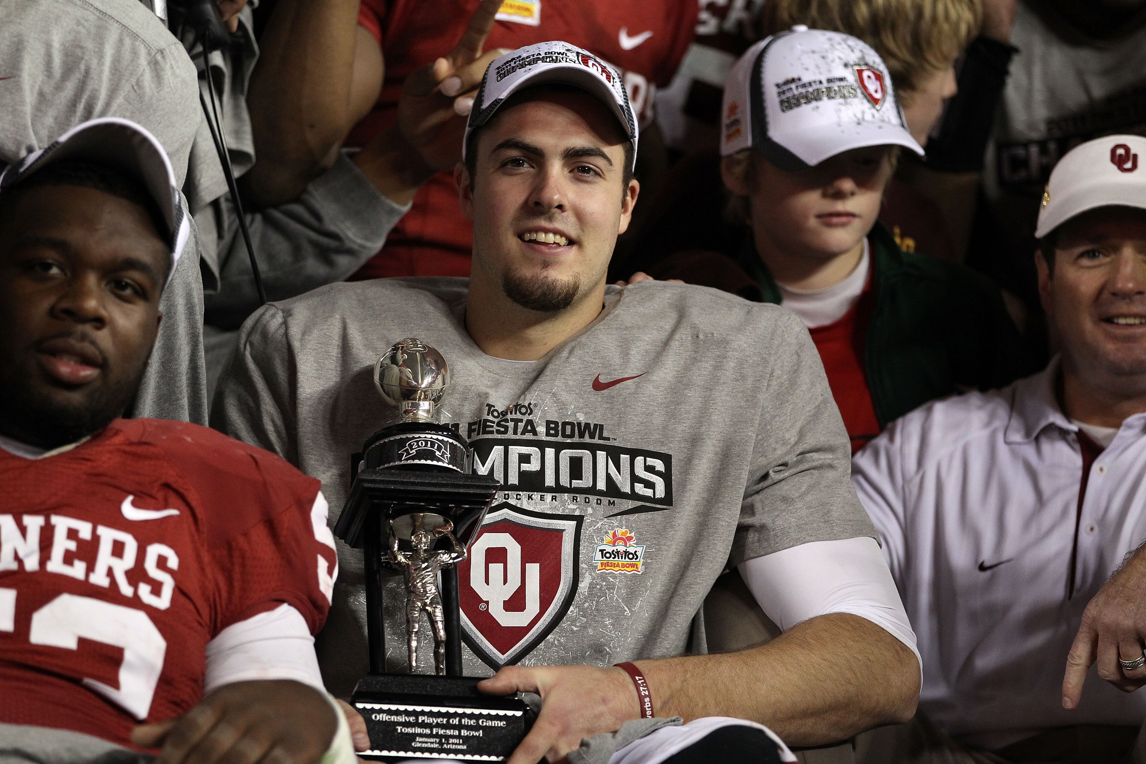 GLENDALE, AZ - JANUARY 01: Quarterback Landry Jones #12 of the Oklahoma Sooners and offensive MVP celebrates the Sooners 48-20 victory against the Connecticut Huskies during the Tostitos Fiesta Bowl at the Universtity of Phoenix Stadium on January 1, 201 GLENDALE, AZ - JANUARY 01: Quarterback Landry Jones #12 of the Oklahoma Sooners and offensive MVP celebrates the Sooners 48-20 victory against the Connecticut Huskies during the Tostitos Fiesta Bowl at the Universtity of Phoenix Stadium on January 1, 201