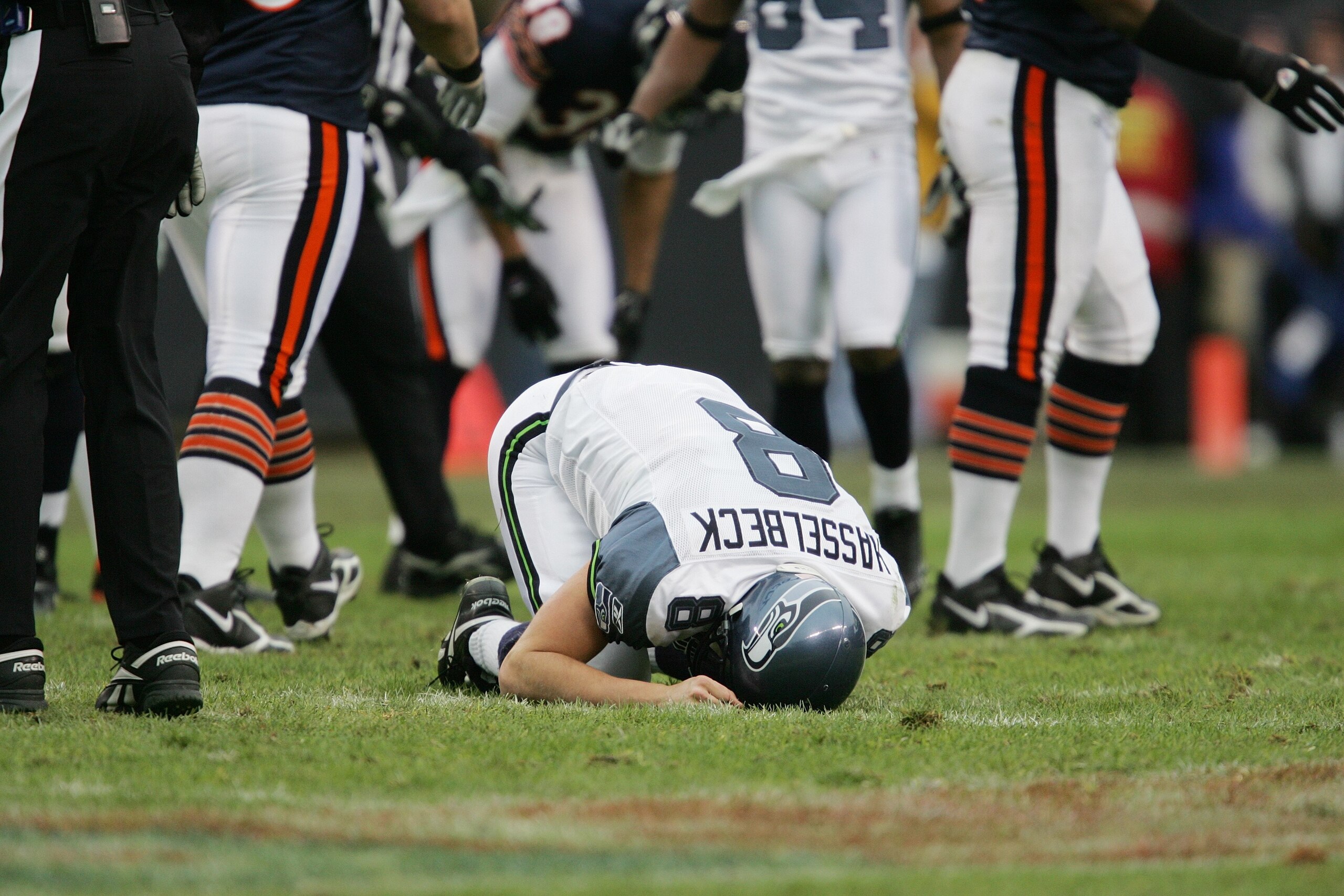 CHICAGO - JANUARY 14: Quarterback Matt Hasselbeck #8 of the Seattle Seahawks lies on the field against the Chicago Bears during their NFC Divisional Playoff game on January 14, 2007 at Soldier Field in Chicago, Illinois.The Bears won 27-24 in overtime. ( CHICAGO - JANUARY 14: Quarterback Matt Hasselbeck #8 of the Seattle Seahawks lies on the field against the Chicago Bears during their NFC Divisional Playoff game on January 14, 2007 at Soldier Field in Chicago, Illinois.The Bears won 27-24 in overtime. (