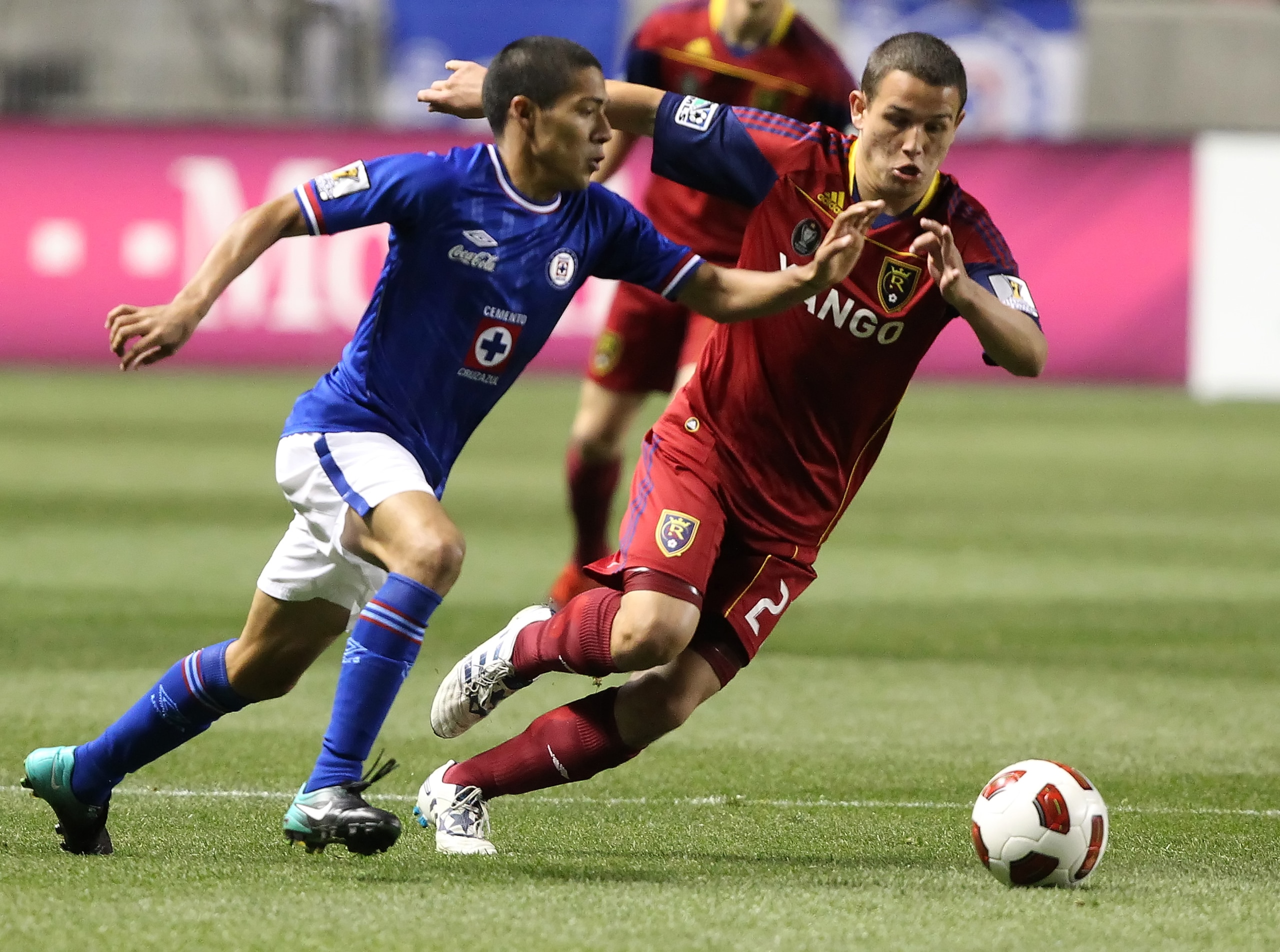 SANDY, UT - SEPTEMBER 19: Luis Gil #21 of Real Salt Lake and Javier Aquino #7 of Cruz Azul chase the ball during the first half of an CONCACAF soccer game October 19, 2010 at Rio Tinto Stadium in Sandy, Utah. (Photo by George Frey/Getty Images) SANDY, UT - SEPTEMBER 19: Luis Gil #21 of Real Salt Lake and Javier Aquino #7 of Cruz Azul chase the ball during the first half of an CONCACAF soccer game October 19, 2010 at Rio Tinto Stadium in Sandy, Utah. (Photo by George Frey/Getty Images)