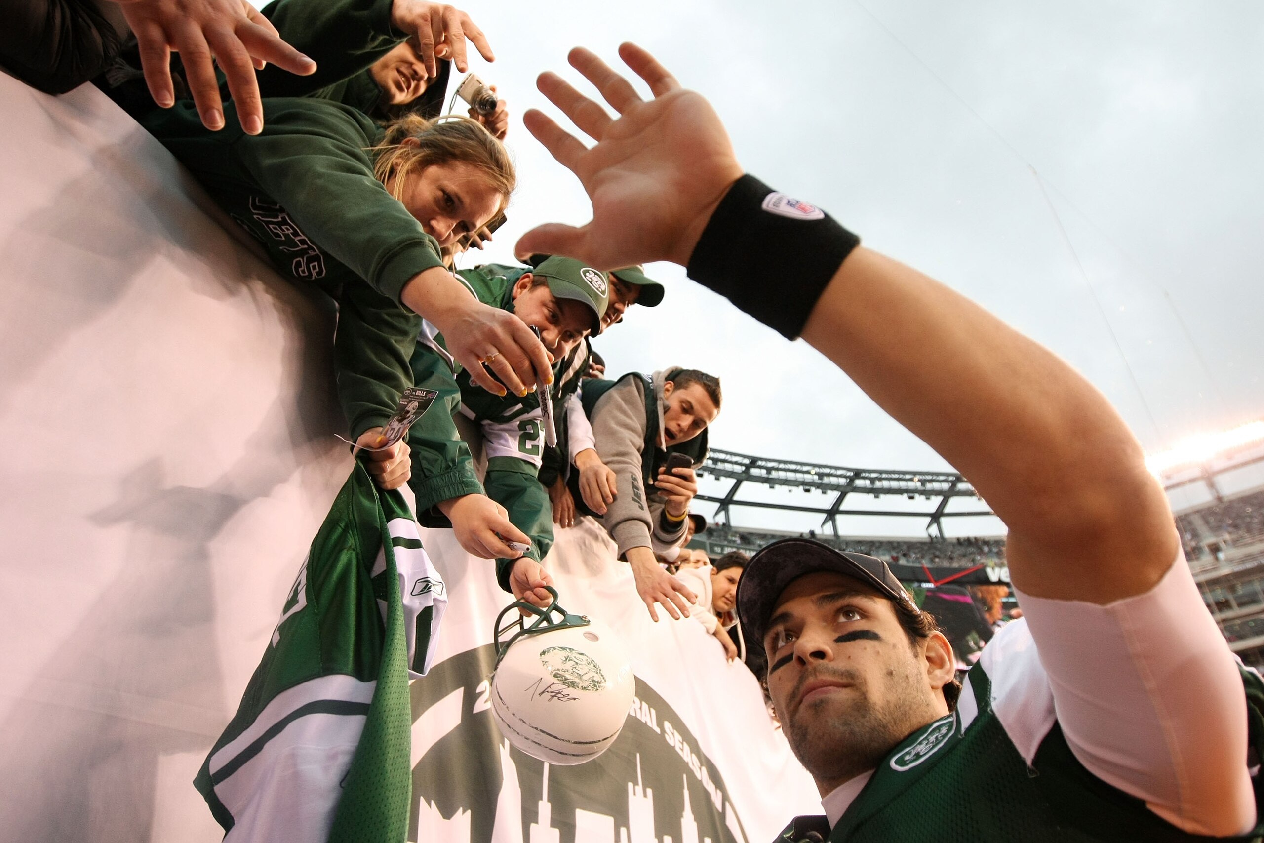 EAST RUTHERFORD, NJ - JANUARY 02:  Quarterback Mark Sanchez #6 of the New York Jets celebrates with fans after they defeated the Buffalo Bills 38 to 7 at New Meadowlands Stadium on January 2, 2011 in East Rutherford, New Jersey.  (Photo by Al Bello/Getty