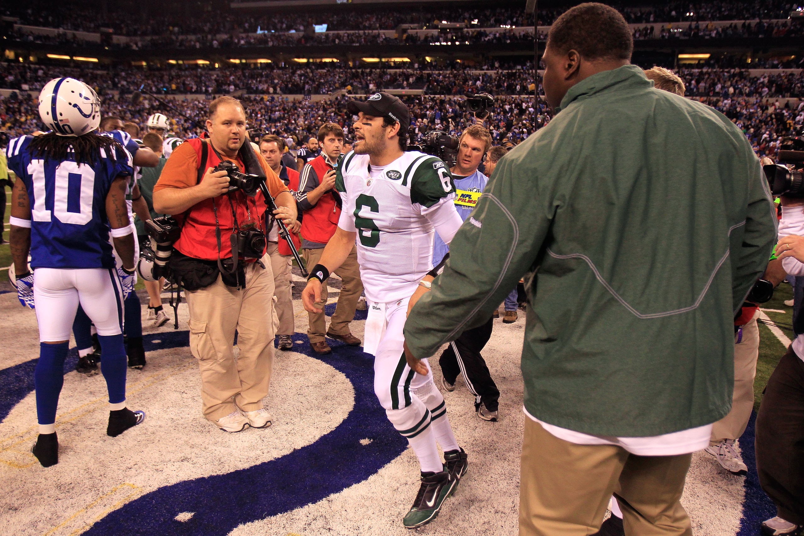 INDIANAPOLIS, IN - JANUARY 08:  Quarterback Mark Sanchez #6 of the New York Jets celebrates as he walks off the field after the Jets won 17-16 against the Indianapolis Colts during their 2011 AFC wild card playoff game at Lucas Oil Stadium on January 8, 2