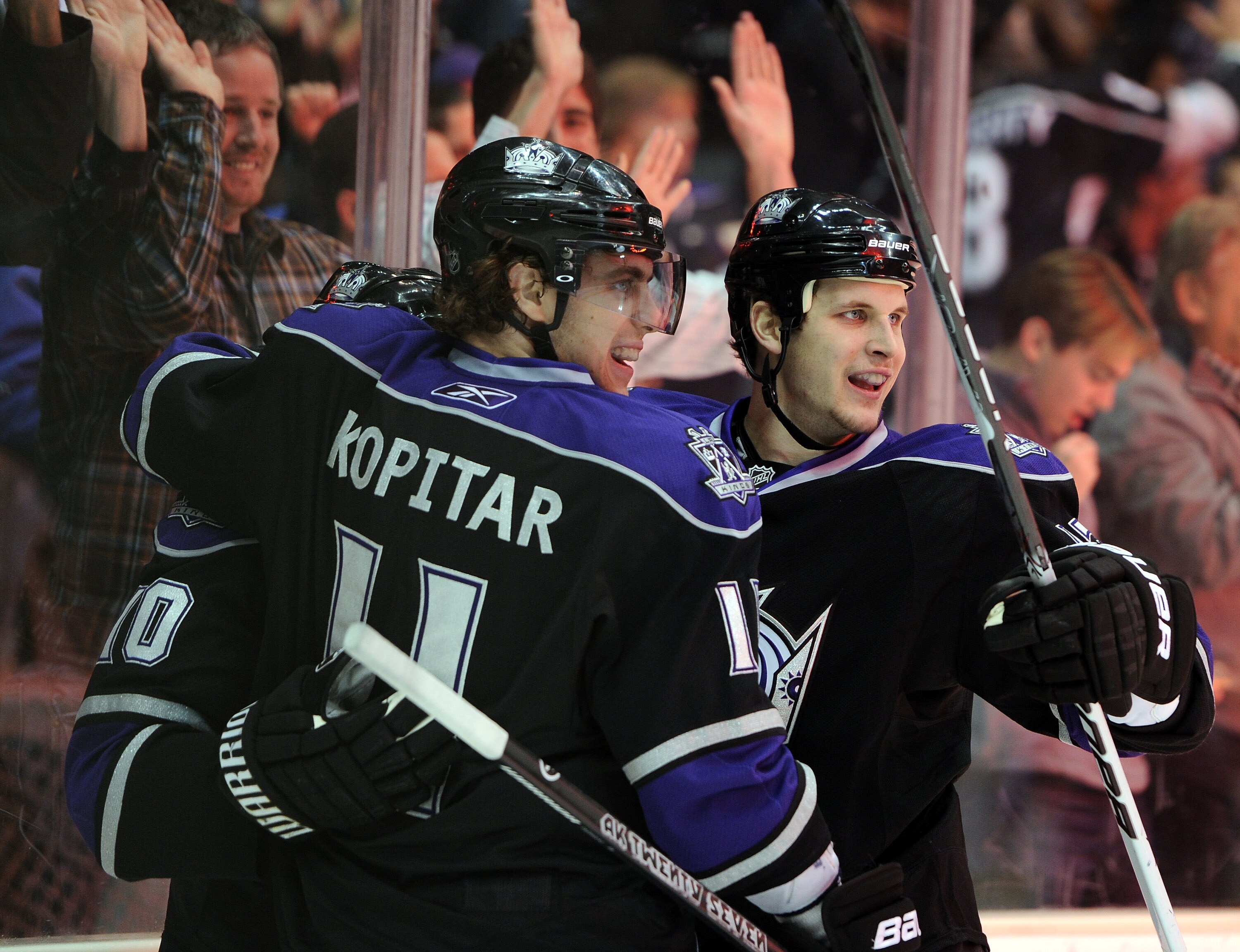 LOS ANGELES, CA - JANUARY 06:  Kyle Clifford #13 of the Los Angeles Kings celebrates his goal with Anze Kopitar #11 for a 1-0 lead over the Nashville Predators during the second period at the Staples Center on January 6, 2011 in Los Angeles, California.