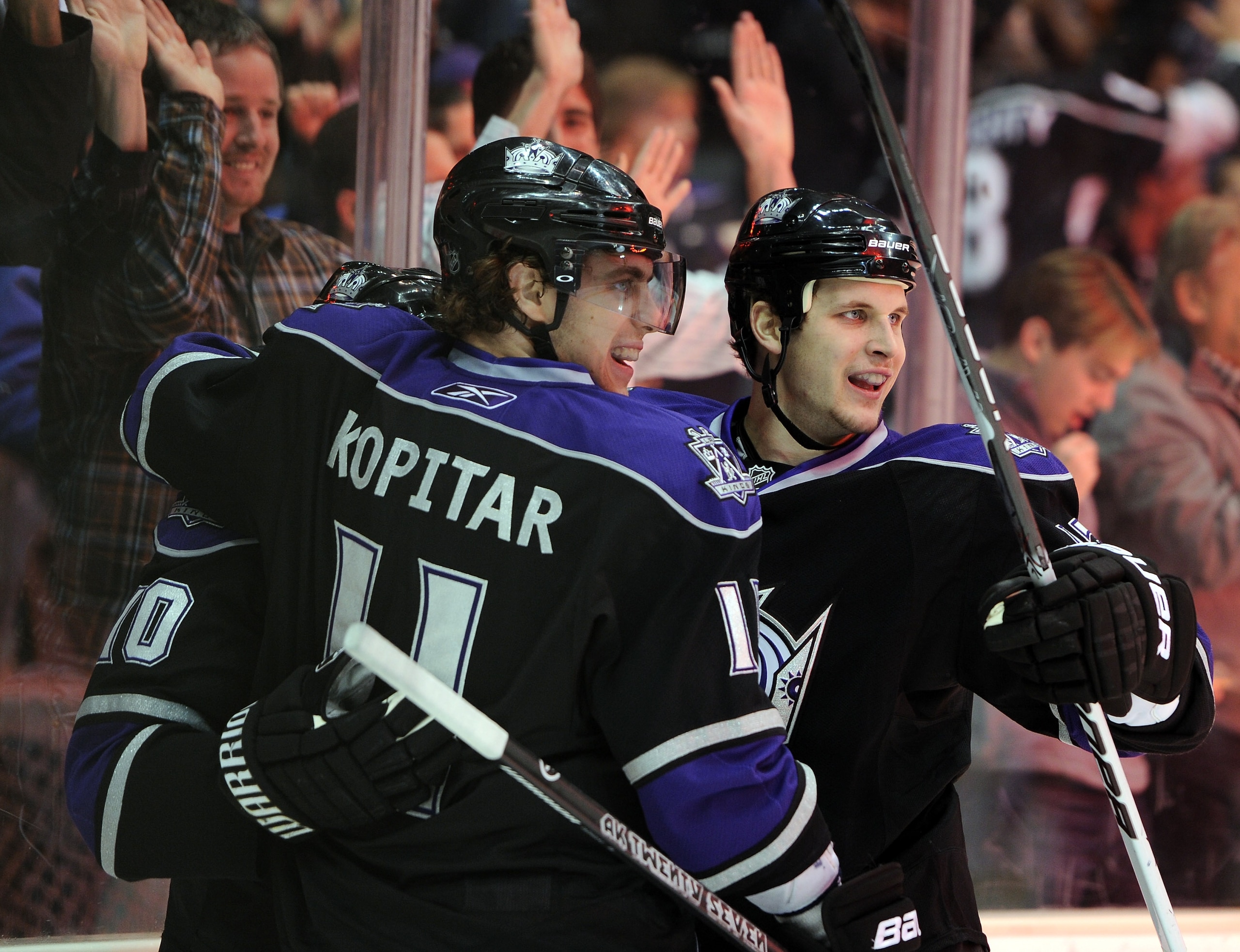 LOS ANGELES, CA - JANUARY 06:  Kyle Clifford #13 of the Los Angeles Kings celebrates his goal with Anze Kopitar #11 for a 1-0 lead over the Nashville Predators during the second period at the Staples Center on January 6, 2011 in Los Angeles, California.