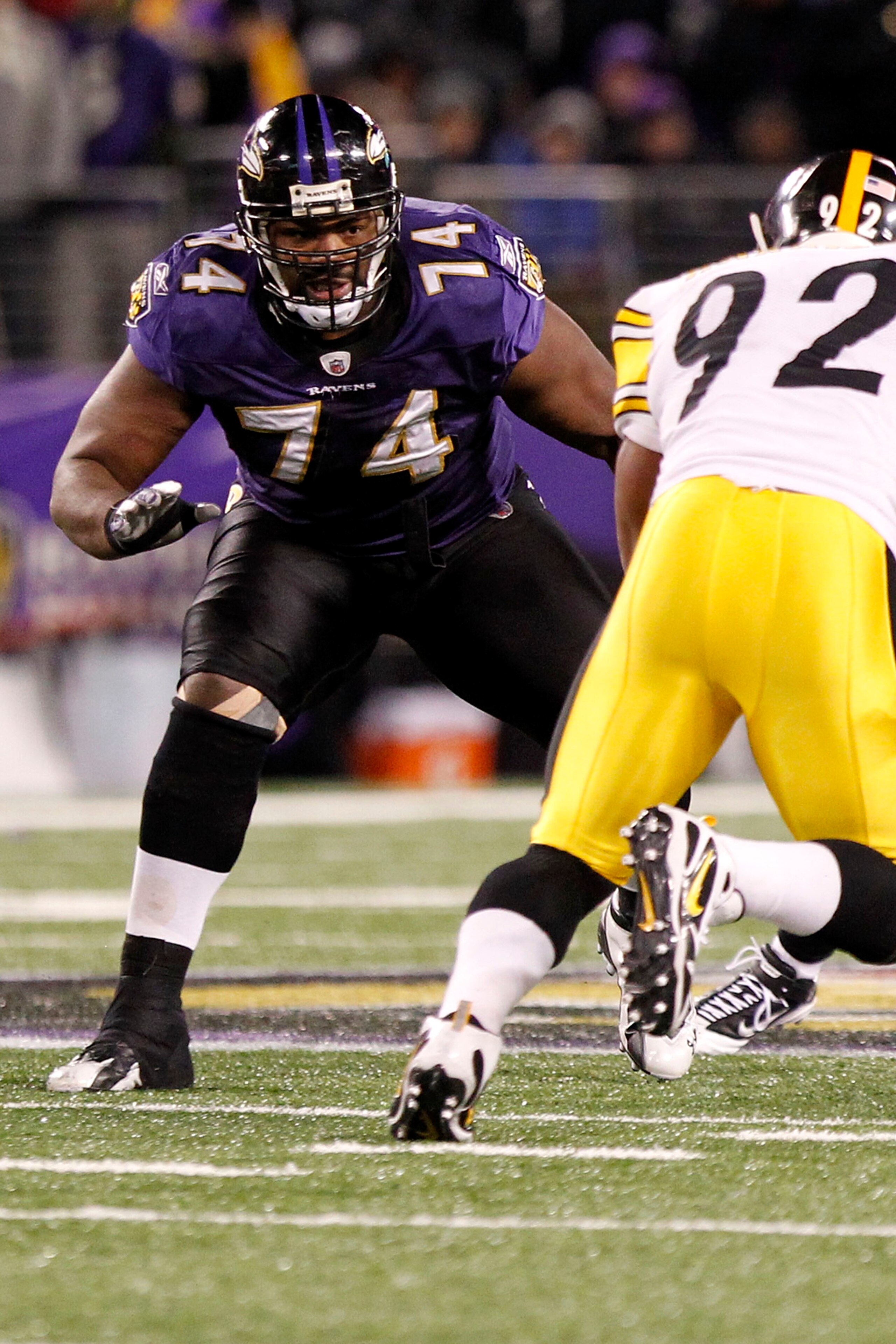 BALTIMORE, MD - DECEMBER 05:  Michael Oher #74 of the Baltimore Ravens blocks James Harrison #92 of the Pittsburgh Steelers at M&T Bank Stadium on December 5, 2010 in Baltimore, Maryland.  (Photo by Geoff Burke/Getty Images)
