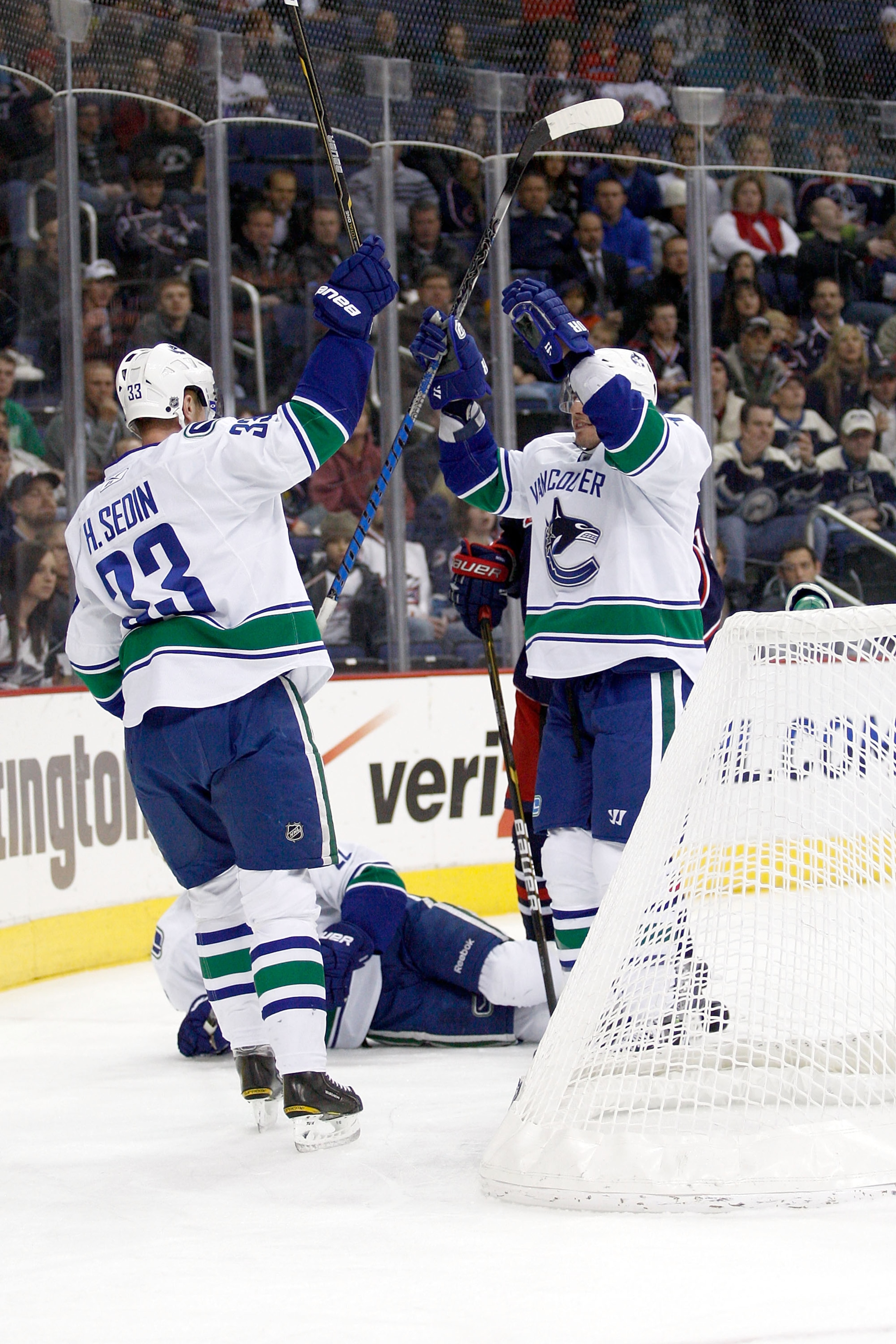 COLUMBUS, OH - DECEMBER 23:  Alexandre Burrows #14 is congratulated by Henrik Sedin #33, both of the Vancouver Canucks, after scoring against the Columbus Blue Jackets during the first period on December 23, 2010 at Nationwide Arena in Columbus, Ohio.  (P
