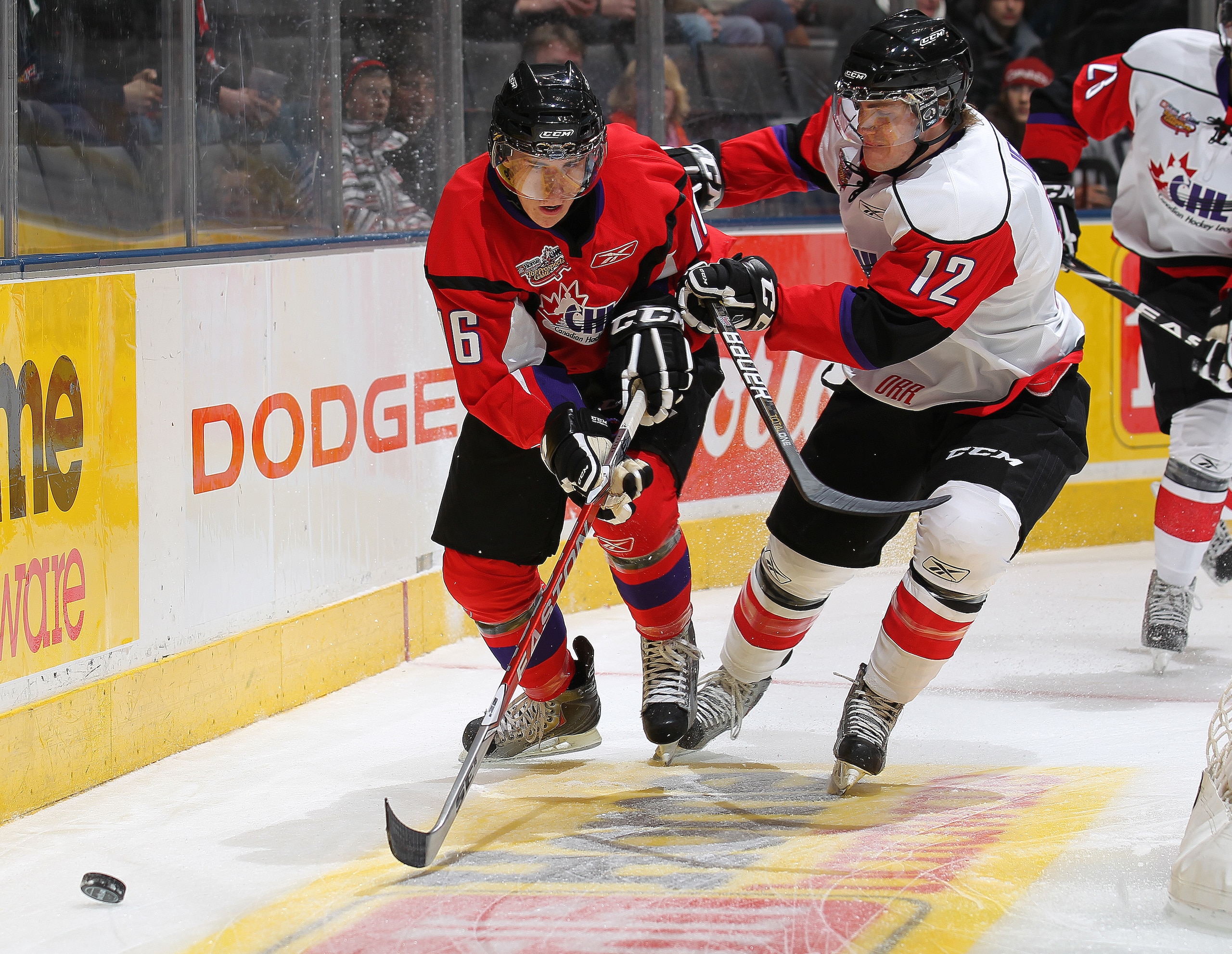 TORONTO, CANADA - JANUARY 19:  Ryan Strome #16 of Team Cherry tries to elude the check of Boone Jenner #12 of Team Orr in the 2011 Home Hardware CHL/NHL Prospects game on January 19, 2011 at the Air Canada Centre in Toronto, Canada. (Photo by Claus Anders