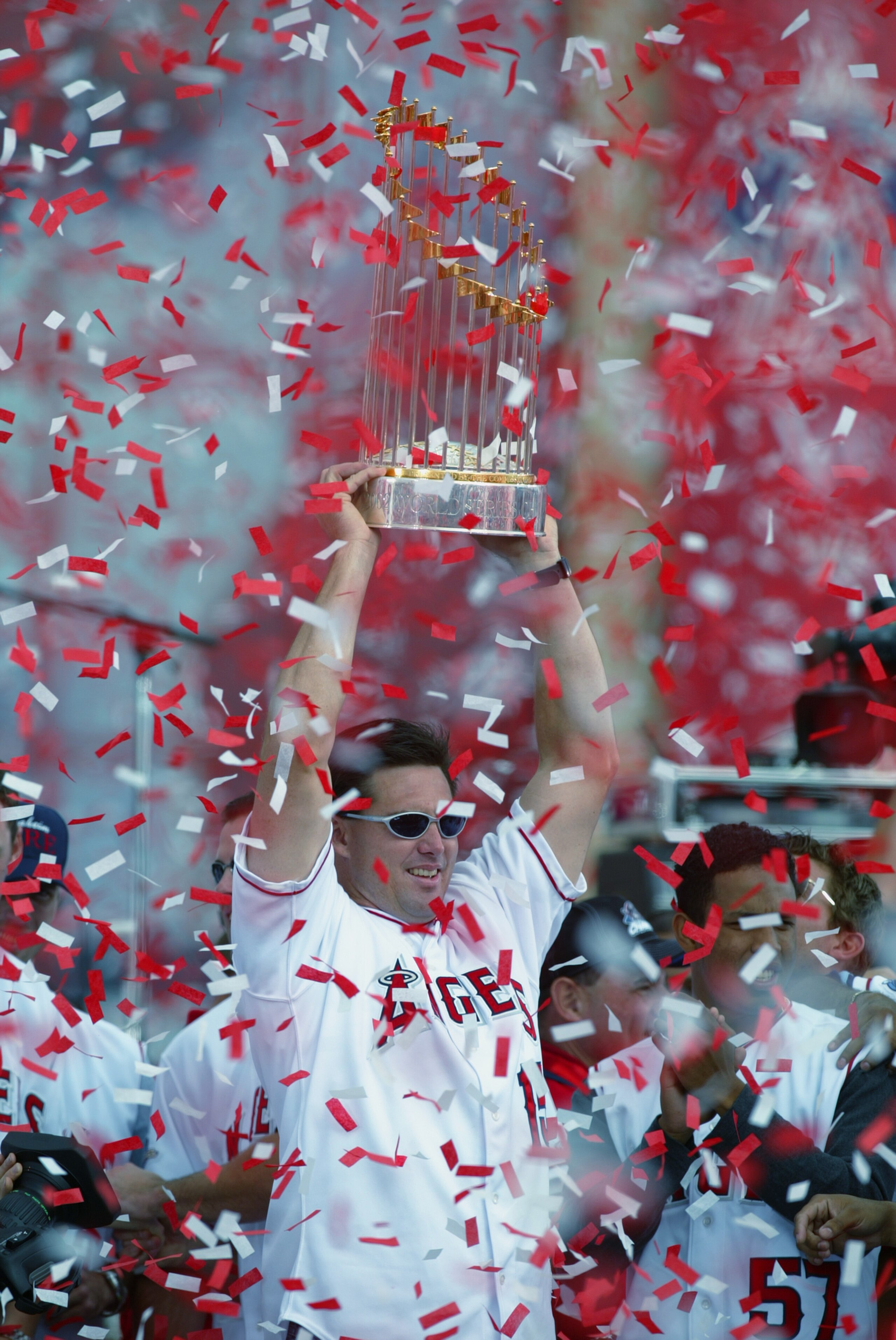 ANAHEIM, CA - OCTOBER 29:  Rightfielder Tim Salmon #15 of the Anaheim Angels holds the Major League Baseball Championship Trophy above his head during the Angels' World Series Victory Parade on October 29, 2002 at Edison International Field in Anaheim, Ca