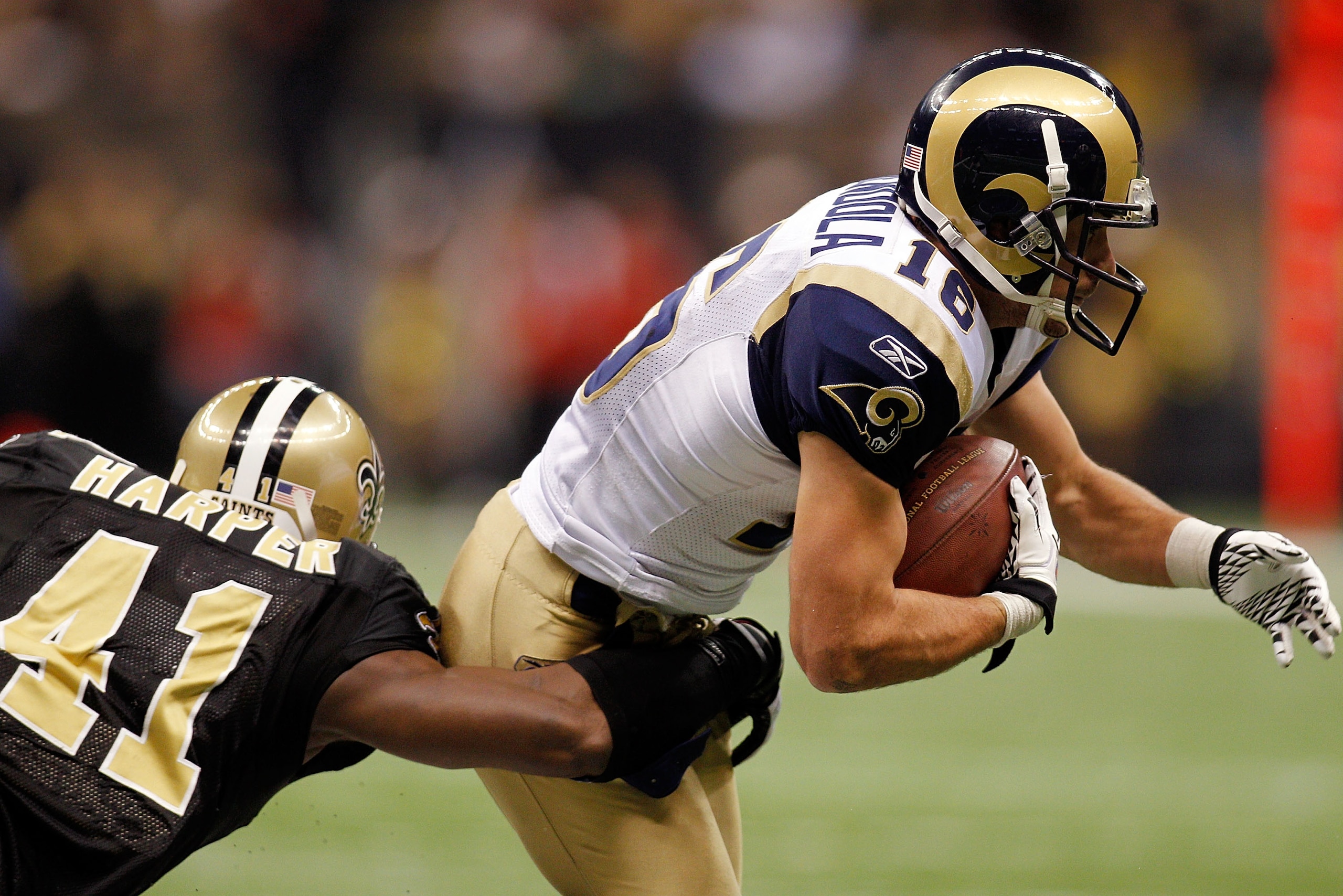 NEW ORLEANS, LA - DECEMBER 12:  Danny Amendola #16 of the St. Louis Rams is tackled by Roman Harper #41 of the New Orleans Saints at the Louisiana Superdome on December 12, 2010 in New Orleans, Louisiana. The Saints defeated the Rams 31-13.  (Photo by Chr