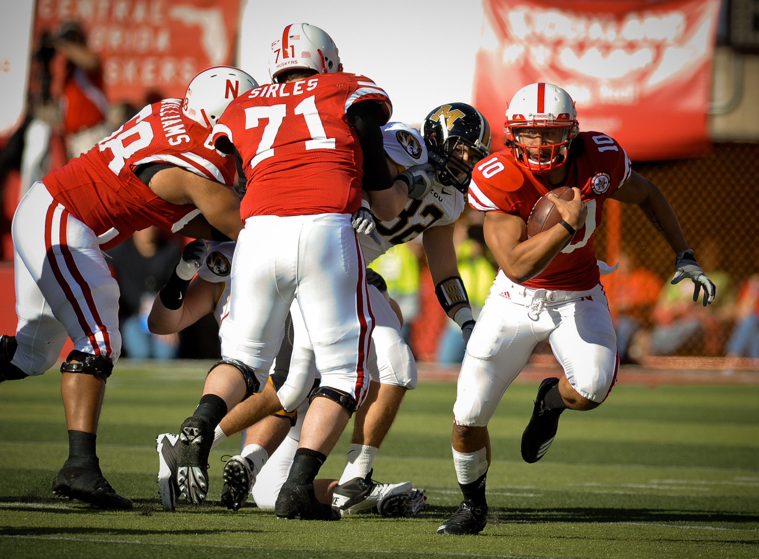 LINCOLN, NE - OCTOBER 30: Running back Roy Helu Jr. #10 of the Nebraska Cornhuskers , with the help of teammates offensive linesman Jeremiah Sirles #71 and offensive linesman Keith Williams #68 break a long run against the Missouri Tigers during second LINCOLN, NE - OCTOBER 30: Running back Roy Helu Jr. #10 of the Nebraska Cornhuskers , with the help of teammates offensive linesman Jeremiah Sirles #71 and offensive linesman Keith Williams #68 break a long run against the Missouri Tigers during second