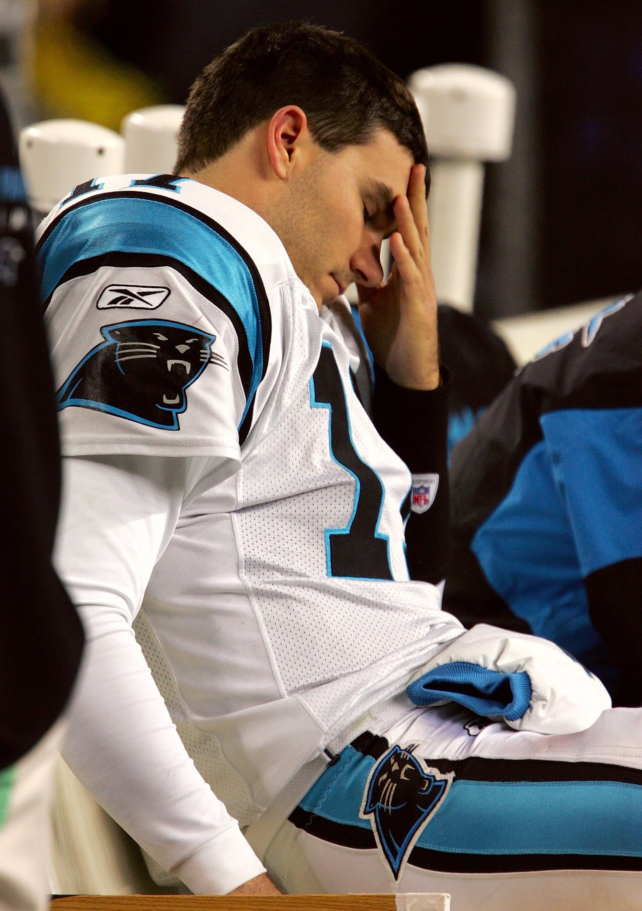 SEATTLE - JANUARY 22:  Quarterback Jake Delhomme #17 of the Carolina Panthers reacts reacts on the bench in the fourth quarter of the NFC Championship Game against the Seattle Seahawks at Qwest Stadium on January 22, 2006 in Seattle, Washington. Seattle w