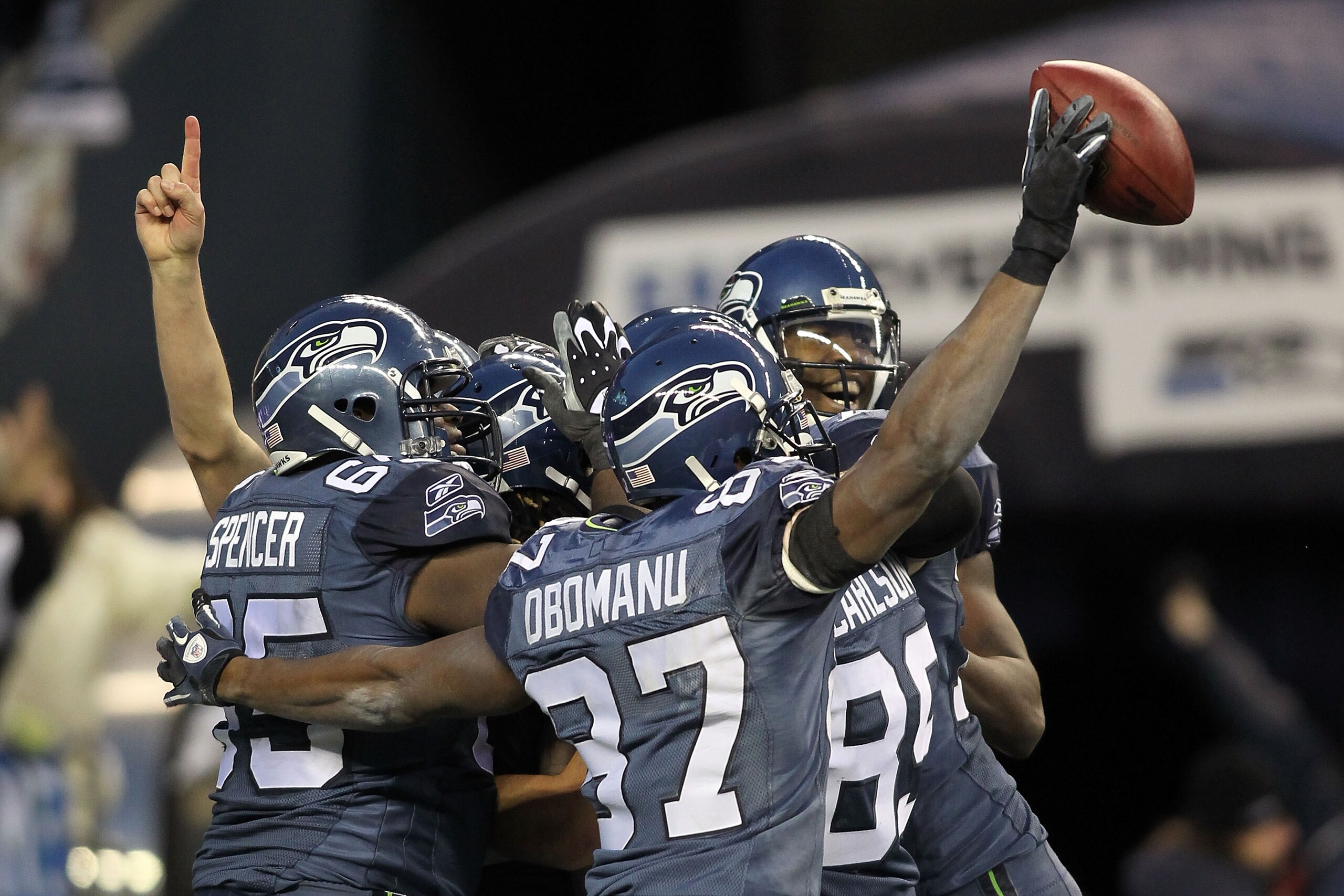 SEATTLE, WA - JANUARY 08:  Running back Marshawn Lynch #24 of the Seattle Seahawks celebrates with his teammates his 67-yard touchdown run in the fourth quarter against the New Orleans Saints during the 2011 NFC wild-card playoff game at Qwest Field on Ja