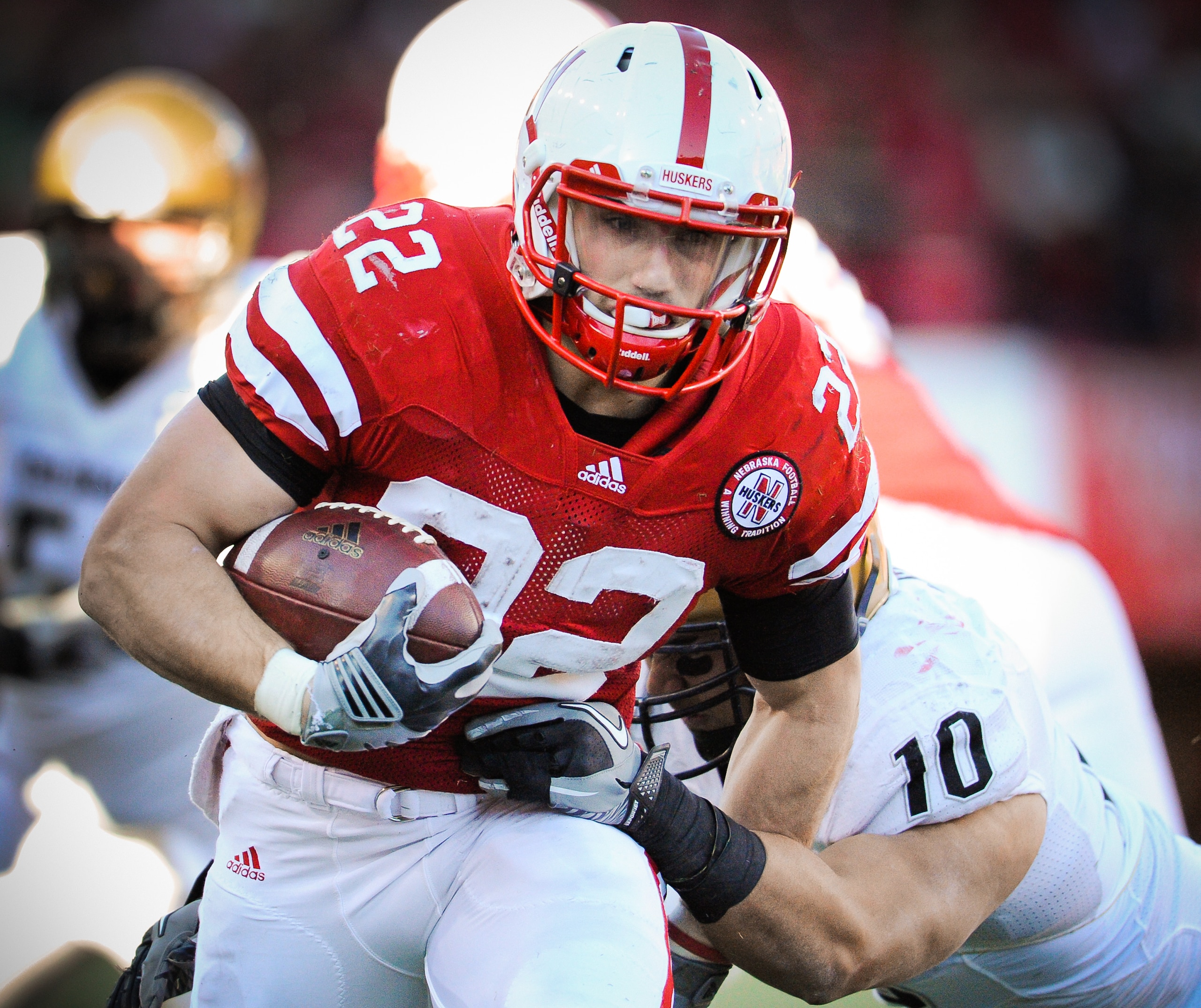 LINCOLN, NE - NOVEMBER 26: Rex Burkhead #22 of the Nebraska Cornhuskers powers through the Colorado Buffalo defense during their game at Memorial Stadium on November 26, 2010 in Lincoln, Nebraska. Nebraska defeated Colorado 45-17 (Photo by Eric Francis/Ge LINCOLN, NE - NOVEMBER 26: Rex Burkhead #22 of the Nebraska Cornhuskers powers through the Colorado Buffalo defense during their game at Memorial Stadium on November 26, 2010 in Lincoln, Nebraska. Nebraska defeated Colorado 45-17 (Photo by Eric Francis/Ge