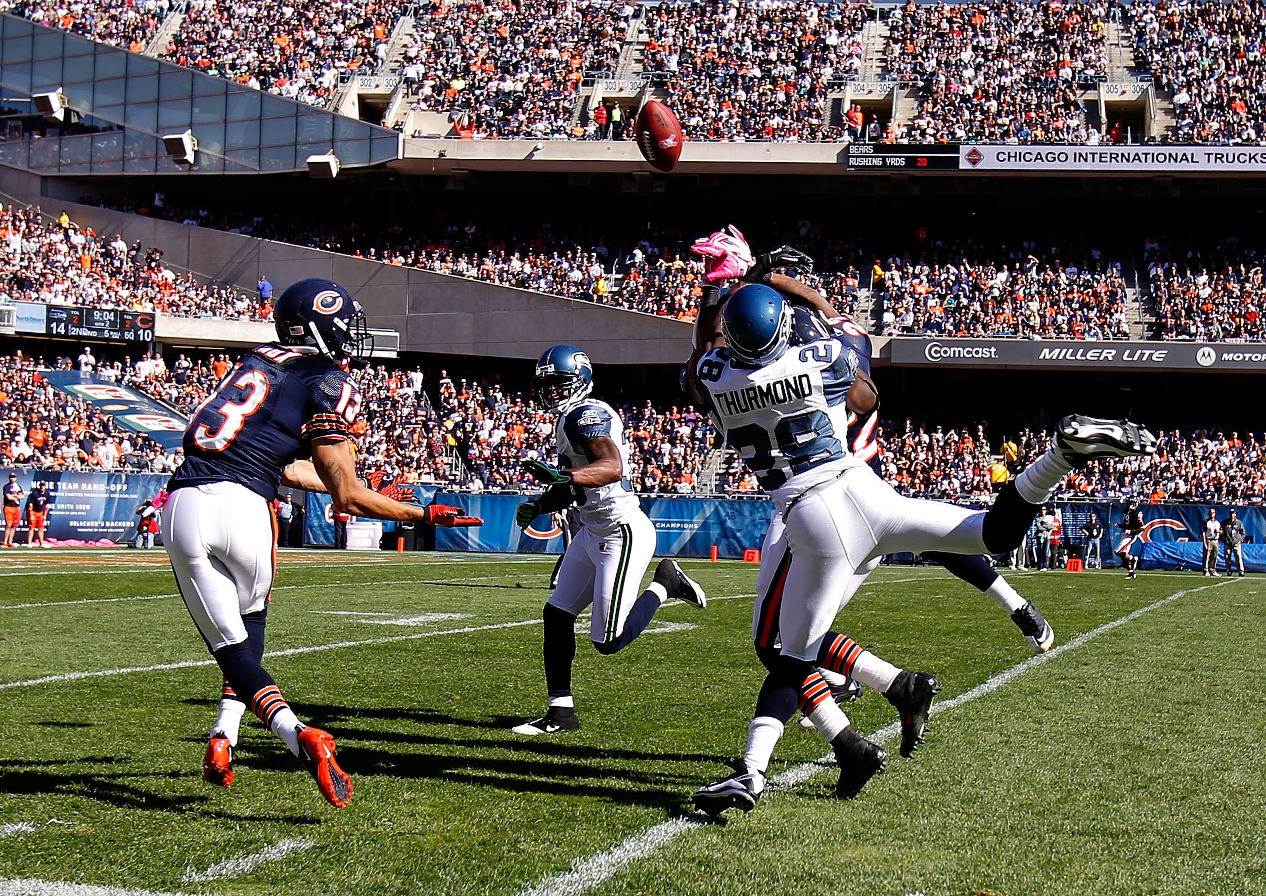 CHICAGO - OCTOBER 17: Walter Thurmond #38 of the Seattle Seahawks breaks up a pass intended for Devin Hester #23 of the Chicago Bears as Johnny Knox #13 attempts a catch at Soldier Field on October 17, 2010 in Chicago, Illinois. The Seahawks defeated the