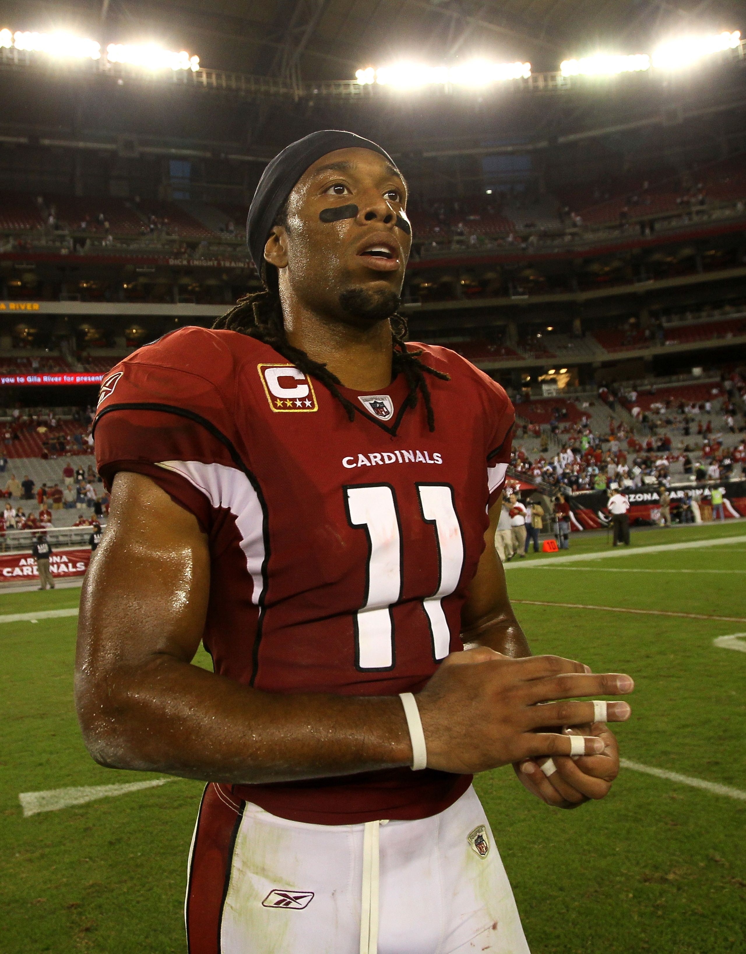 GLENDALE, AZ - NOVEMBER 14:  Wide receiver Larry Fitzgerald #11 of the Arizona Cardinals walks off the field after the game with the Seattle Seahawks at University of Phoenix Stadium on November 14, 2010 in Glendale, Arizona. Seattle won 36-18.  (Photo by