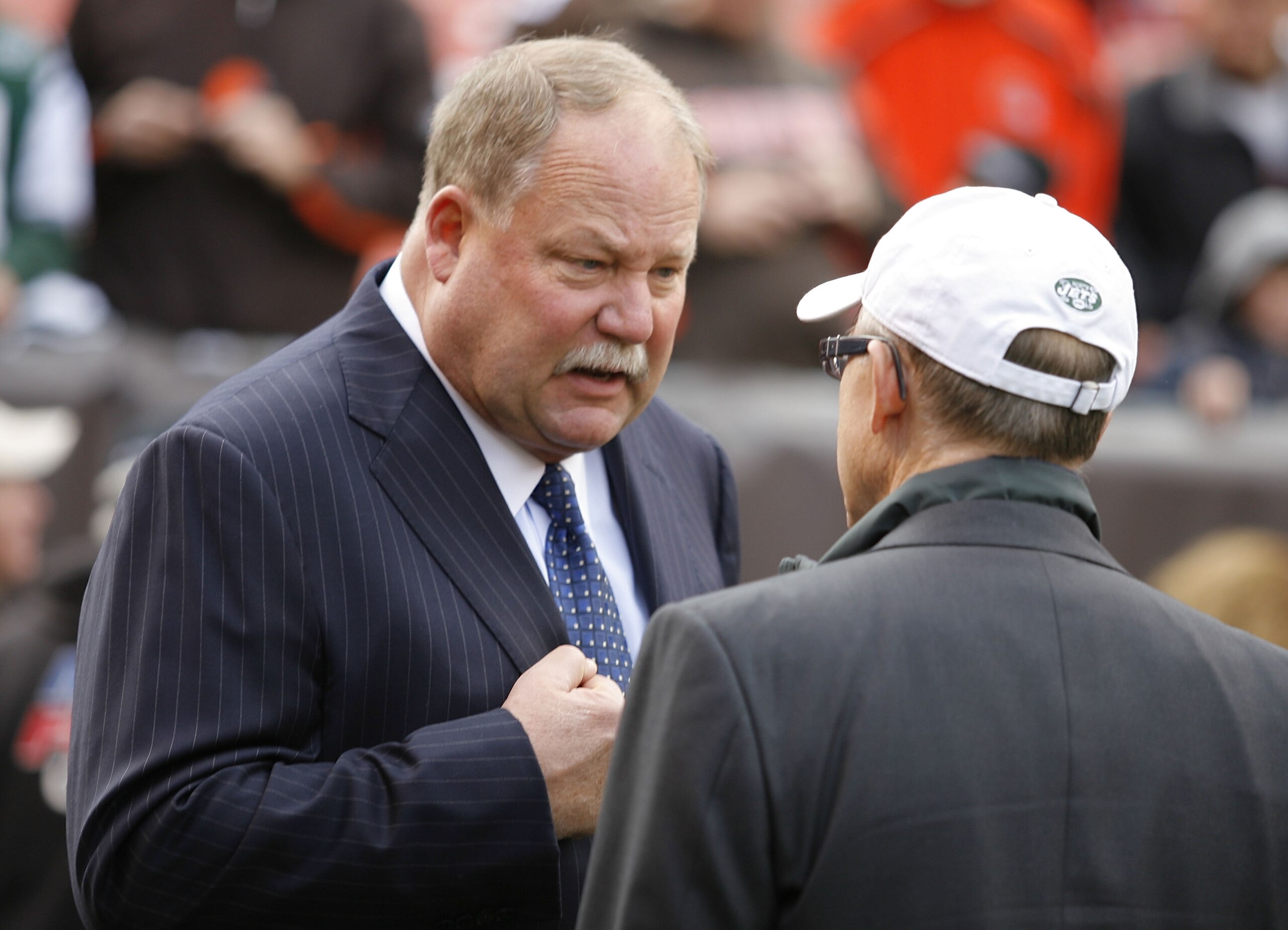 CLEVELAND - NOVEMBER 14: Owner Woody Johnson of the New York Jets talks with general manager Mike Holmgren of the Cleveland Browns prior to the start of their game at Cleveland Browns Stadium on November 14, 2010 in Cleveland, Ohio. (Photo by Matt Sulli CLEVELAND - NOVEMBER 14: Owner Woody Johnson of the New York Jets talks with general manager Mike Holmgren of the Cleveland Browns prior to the start of their game at Cleveland Browns Stadium on November 14, 2010 in Cleveland, Ohio. (Photo by Matt Sulli