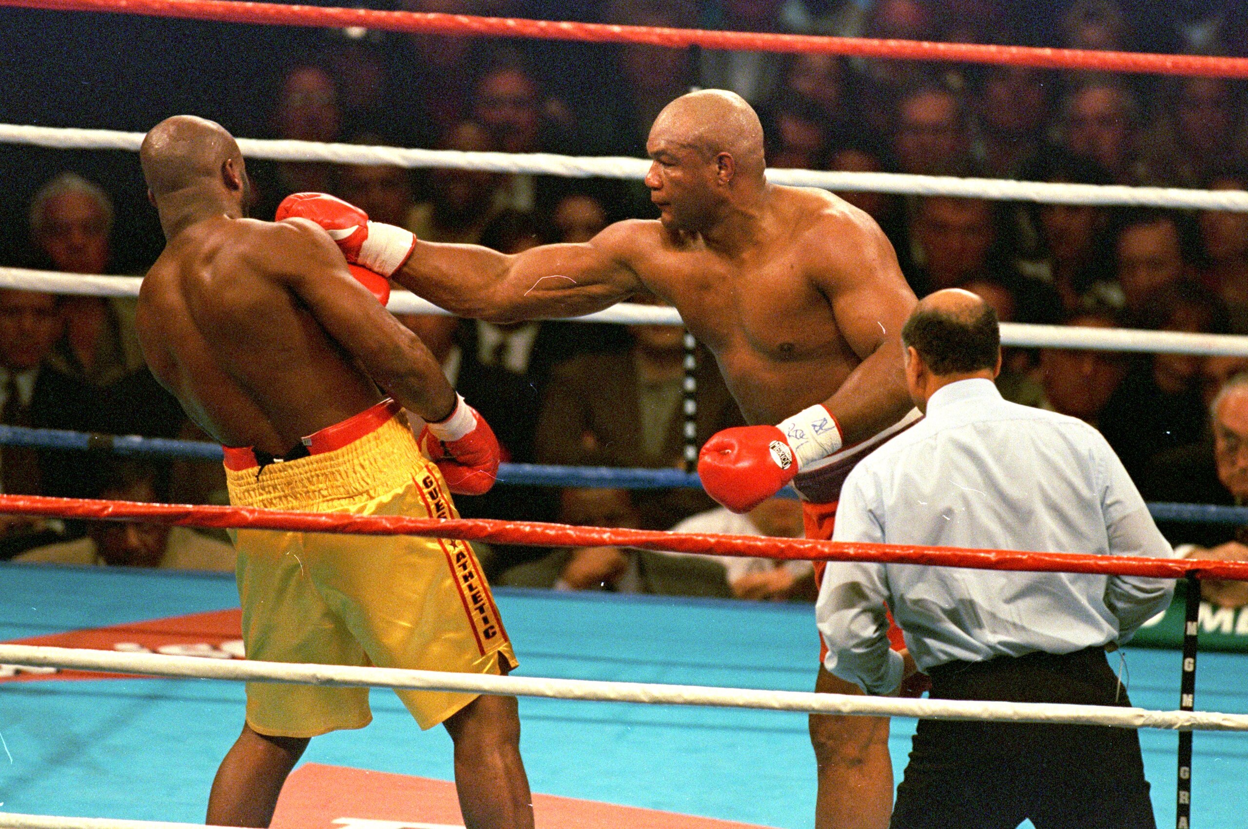 5 Nov 1995:  George Foreman trows a left punch at Michael Moorer during the fight in Las Vegas. Forman wins by a knock out in round 10. Mandatory Credit: Al Bello  /Allsport