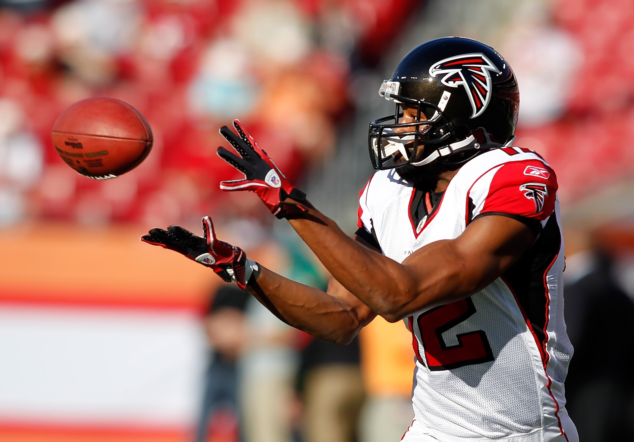TAMPA, FL - DECEMBER 05:  Receiver Michael Jenkins #12 of the Atlanta Falcons catches a pass during warmups against the Tampa Bay Buccaneers at Raymond James Stadium on December 5, 2010 in Tampa, Florida.  (Photo by J. Meric/Getty Images)