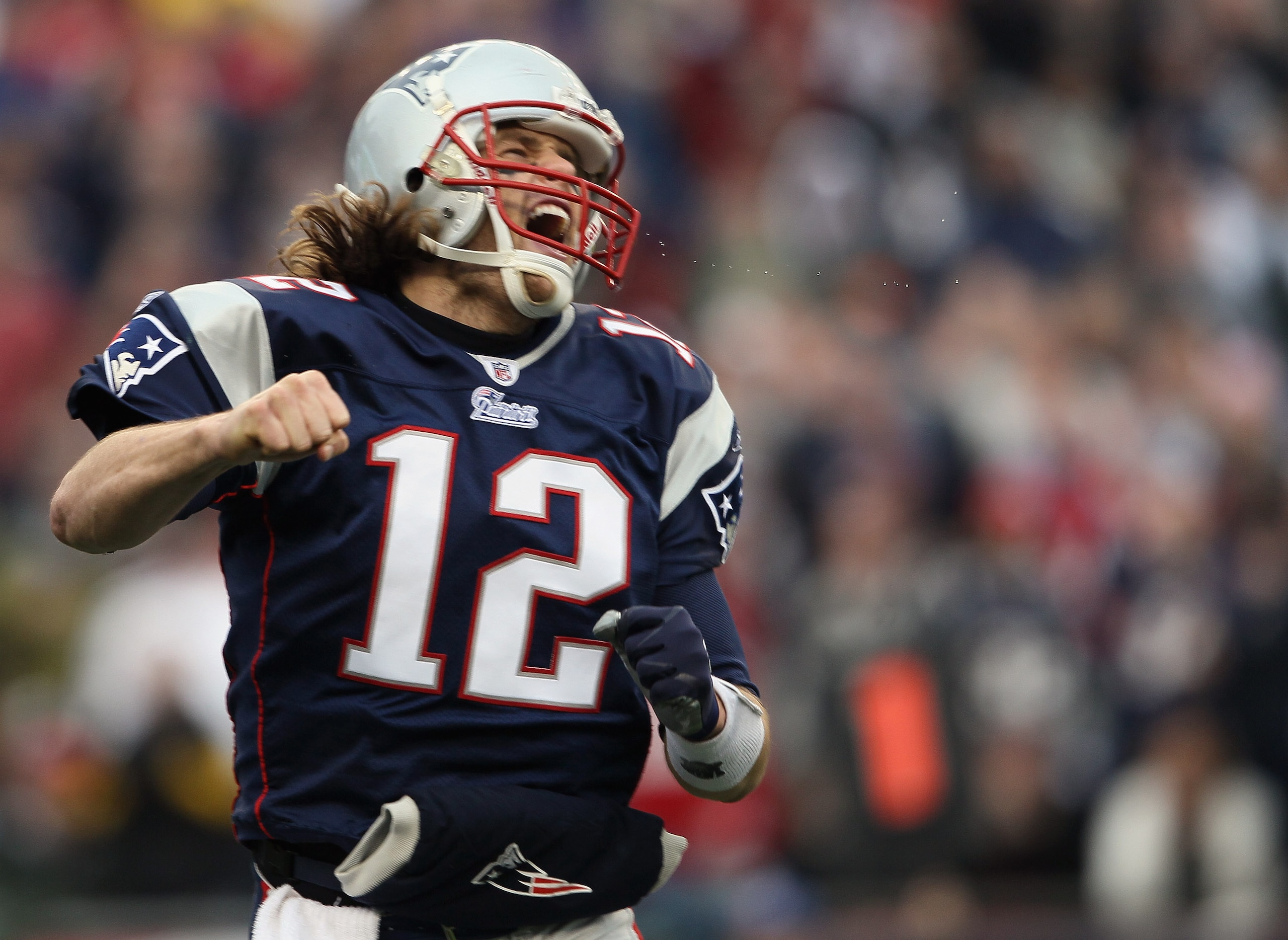 FOXBORO, MA - JANUARY 02: Tom Brady #12 of the New England Patriots celebrates a touchdown by teammate BenJarvis Green-Ellis in the first quarter against the Miami Dolphins on January 2, 2011 at Gillette Stadium in Foxboro, Massachusetts. (Photo by Elsa FOXBORO, MA - JANUARY 02: Tom Brady #12 of the New England Patriots celebrates a touchdown by teammate BenJarvis Green-Ellis in the first quarter against the Miami Dolphins on January 2, 2011 at Gillette Stadium in Foxboro, Massachusetts. (Photo by Elsa
