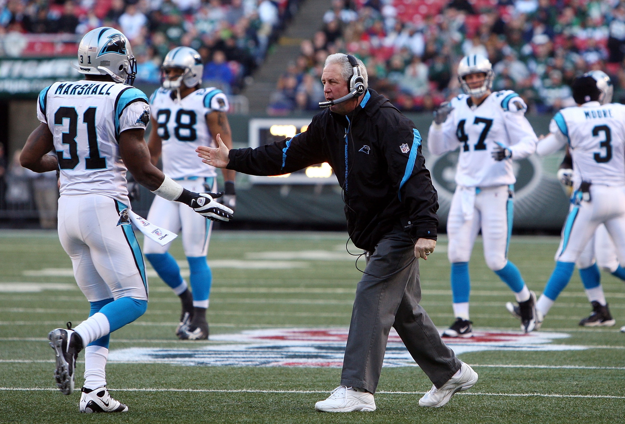 EAST RUTHERFORD, NJ - NOVEMBER 29: Head coach John Fox of the Carolina Panthers congratulates Richard Marshall #31 on his fumble reconery against the New York Jets on November 29, 2009 at Giants Stadium in East Rutherford, New Jersey. The Jets defeated t EAST RUTHERFORD, NJ - NOVEMBER 29: Head coach John Fox of the Carolina Panthers congratulates Richard Marshall #31 on his fumble reconery against the New York Jets on November 29, 2009 at Giants Stadium in East Rutherford, New Jersey. The Jets defeated t