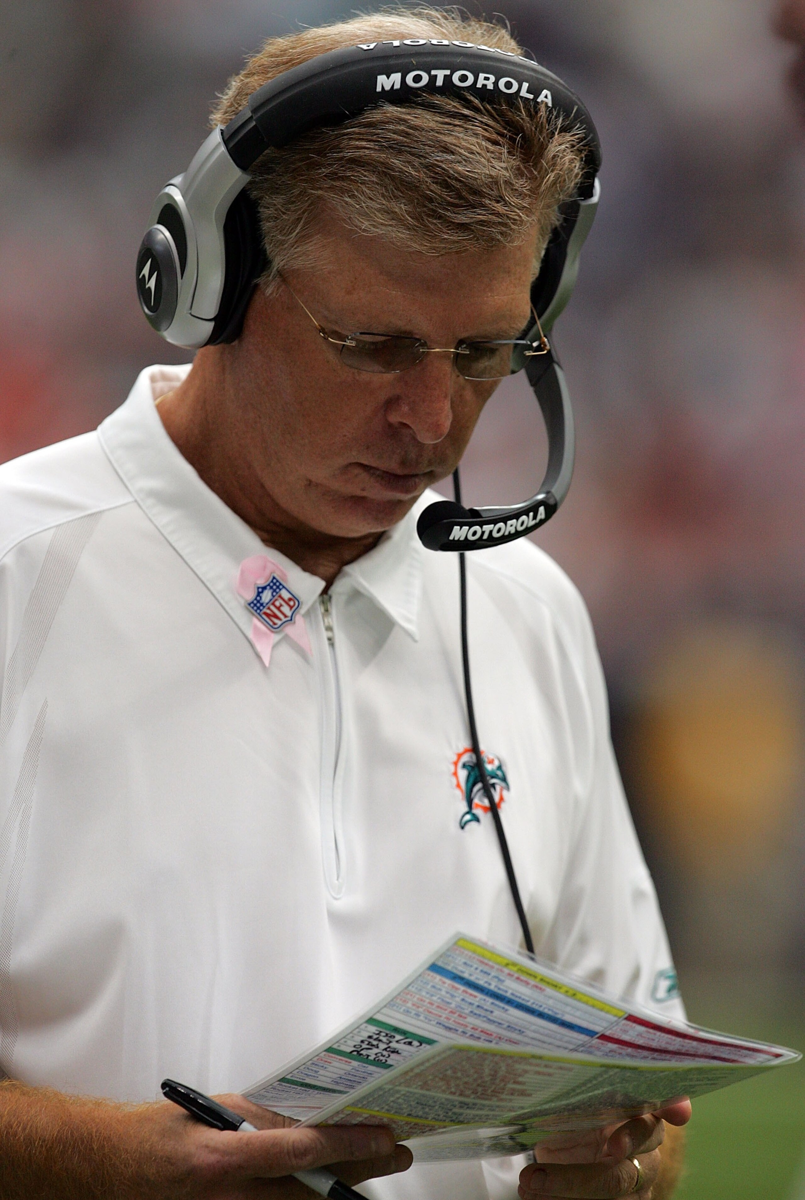HOUSTON - OCTOBER 07:  Head coach Cam Cameron of the Miami Dolphins wears a pink ribbon in aid of Breast Cancer Awareness during a game with the Houston Texans at Reliant Stadium on October 7, 2007 in Houston, Texas.  (Photo by Ronald Martinez/Getty Image