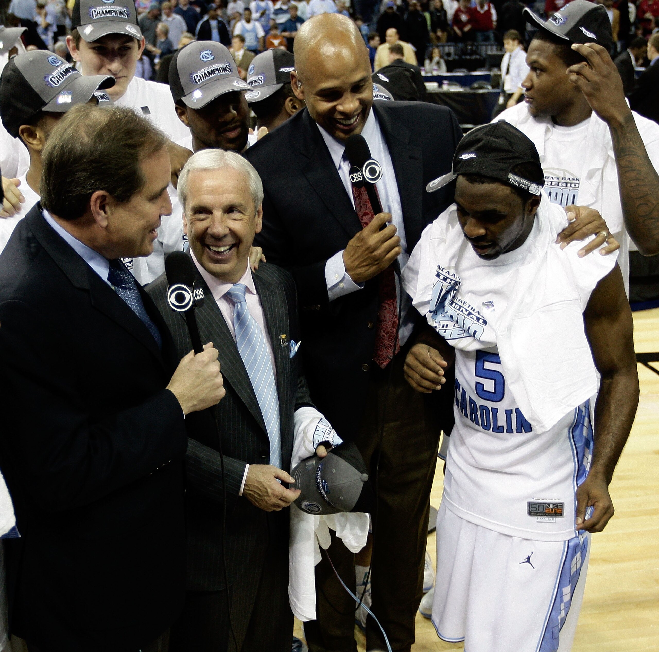 MEMPHIS, TN - MARCH 29:  CBS broadcasters Jim Nantz (L) and Clark Kellogg (2nd R) interview head coach Roy Williams (2nd L) and Ty Lawson #5 (R) of the North Carolina Tar Heels after the Tar Heels defeated the Oklahoma Sooners during the NCAA Men's Basket