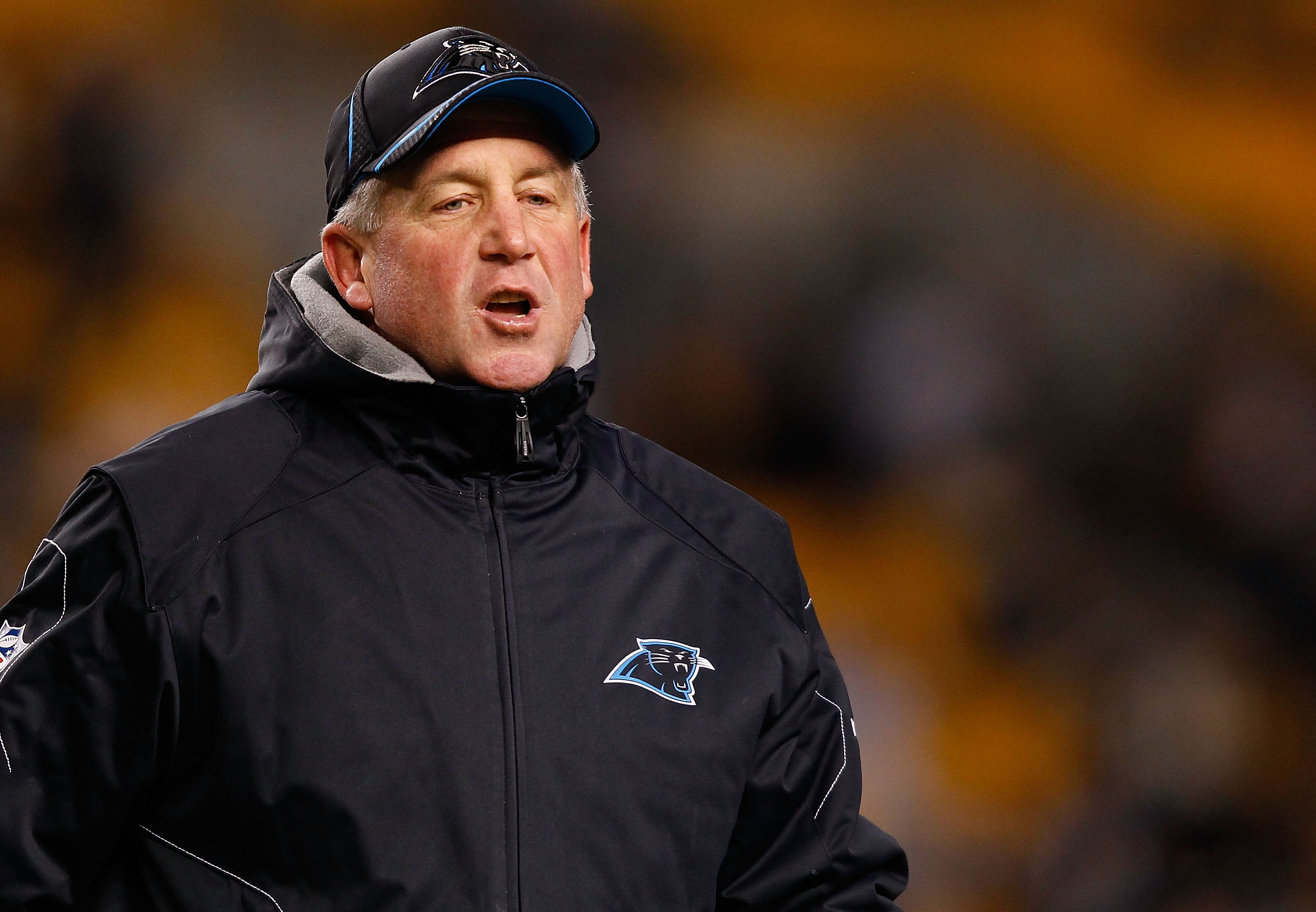 Denver Broncos head coach John Fox wears a New York police department hat  during the game against the Oakland Raiders in remembrance of the tenth  anniversary of 9-11 at Sports Authority Field