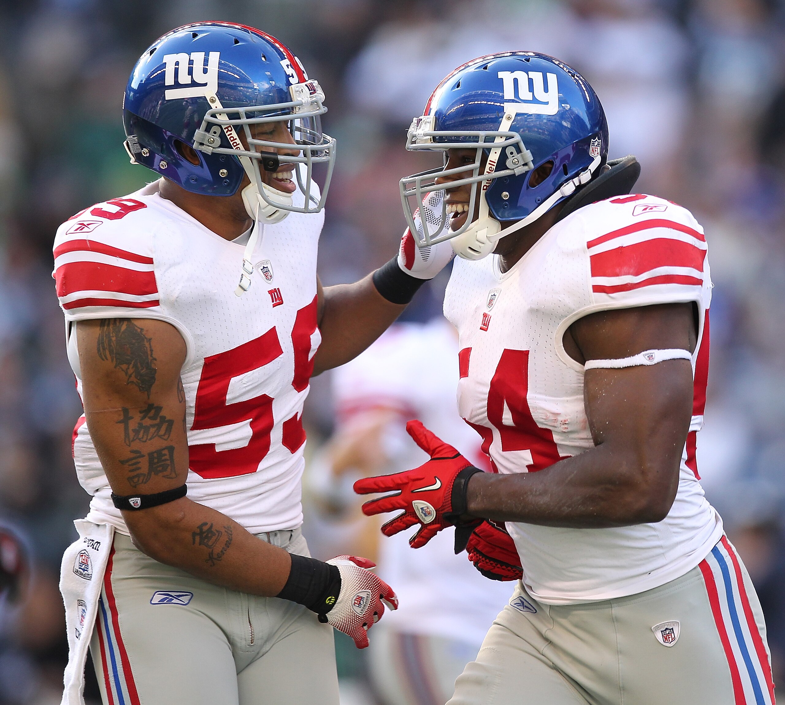 SEATTLE - NOVEMBER 07:  Linebacker Jonathan Goff #54 (R) of the New York Giants celebrates with Michael Boley #59 after recovering a fumble against the Seattle Seahawks at Qwest Field on November 7, 2010 in Seattle, Washington. The Giants defeated the Sea
