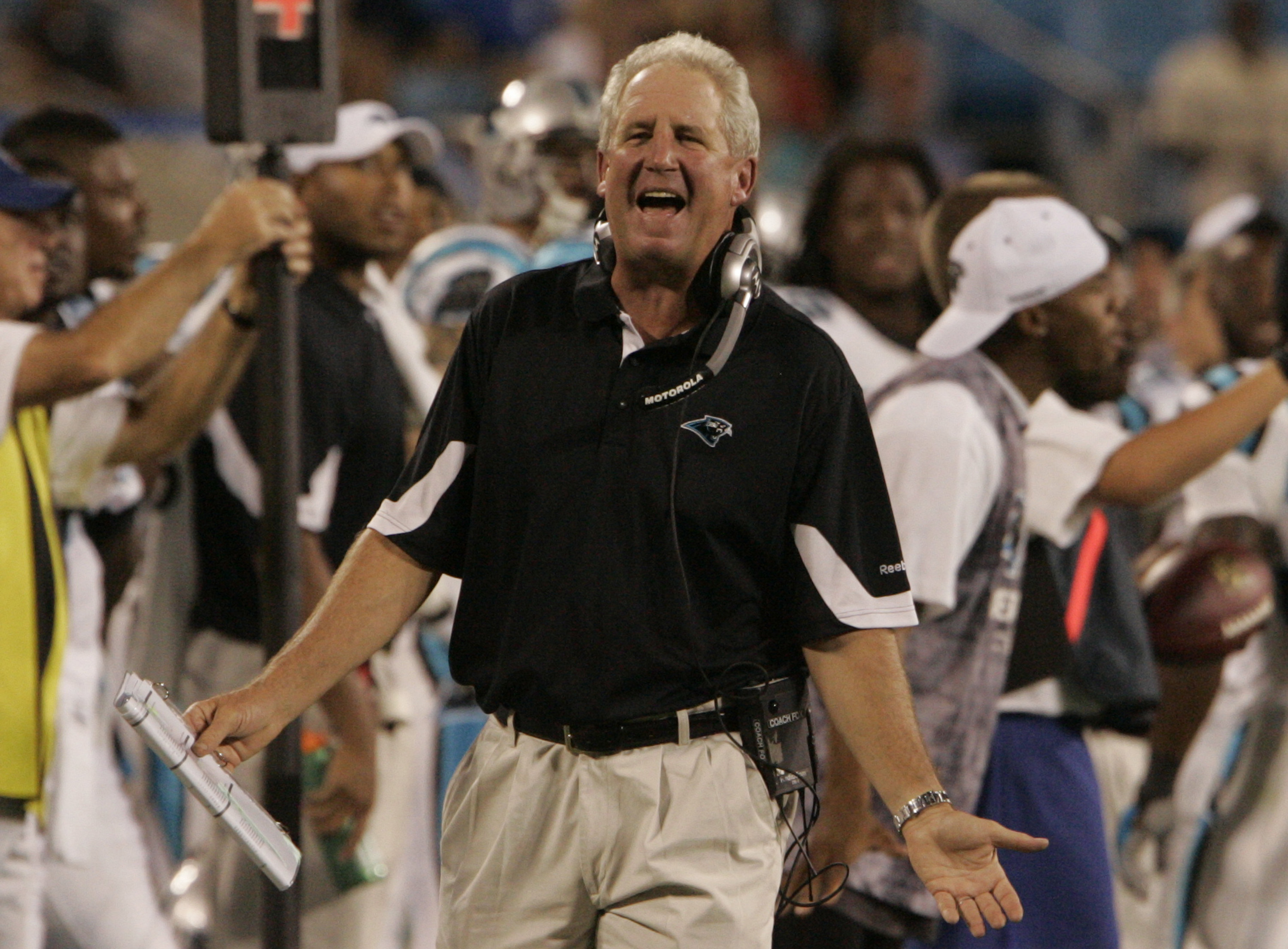 Denver Broncos head coach John Fox watches a video replay board in