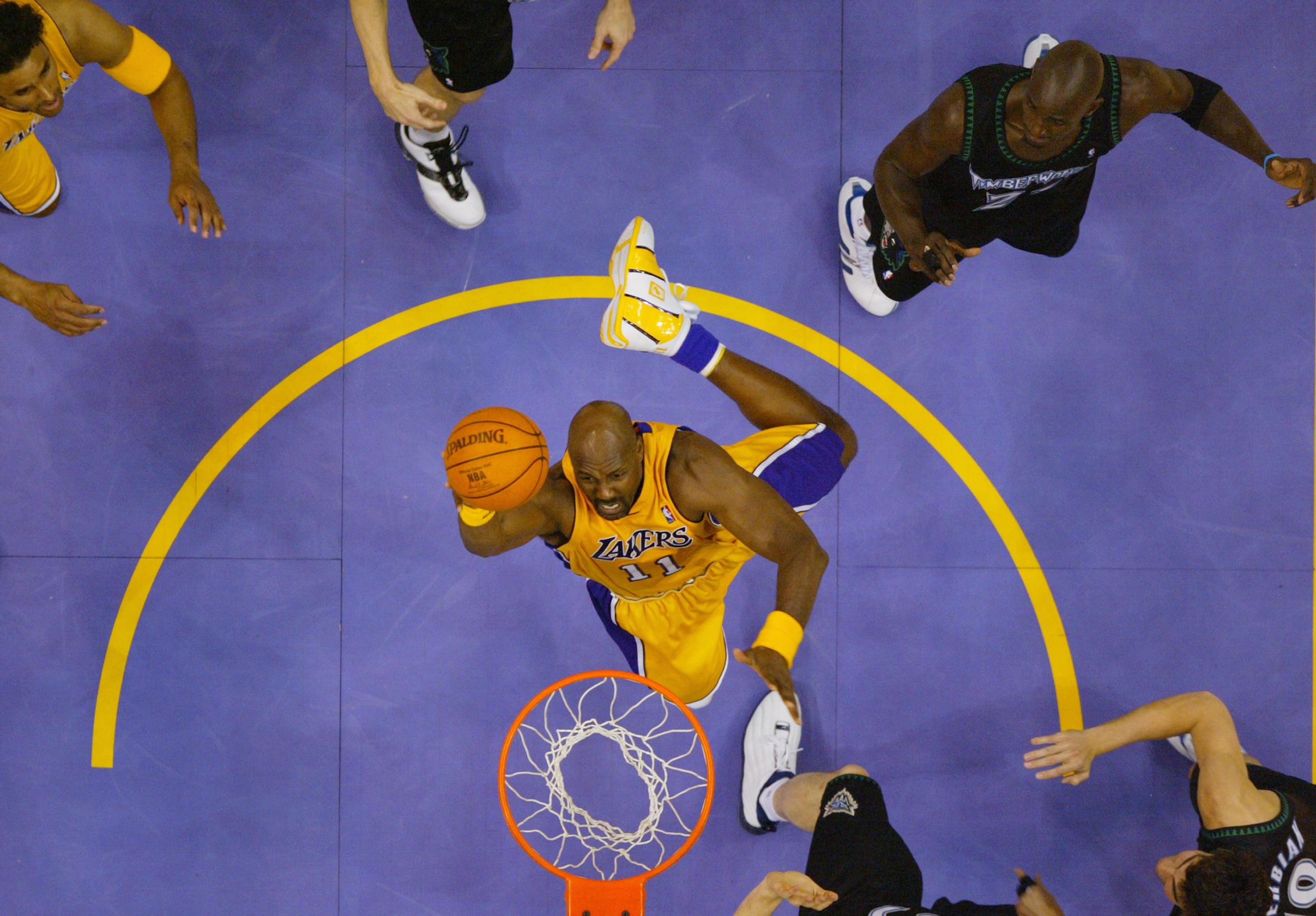 LOS ANGELES - MAY 27:  Karl Malone #11 of the Los Angeles Lakers shoots against the Minnesota Timberwolves in Game four of the Western Conference Finals during the 2004 NBA Playoffs at Staples Center on May 27, 2004 in Los Angeles, California.  The Lakers