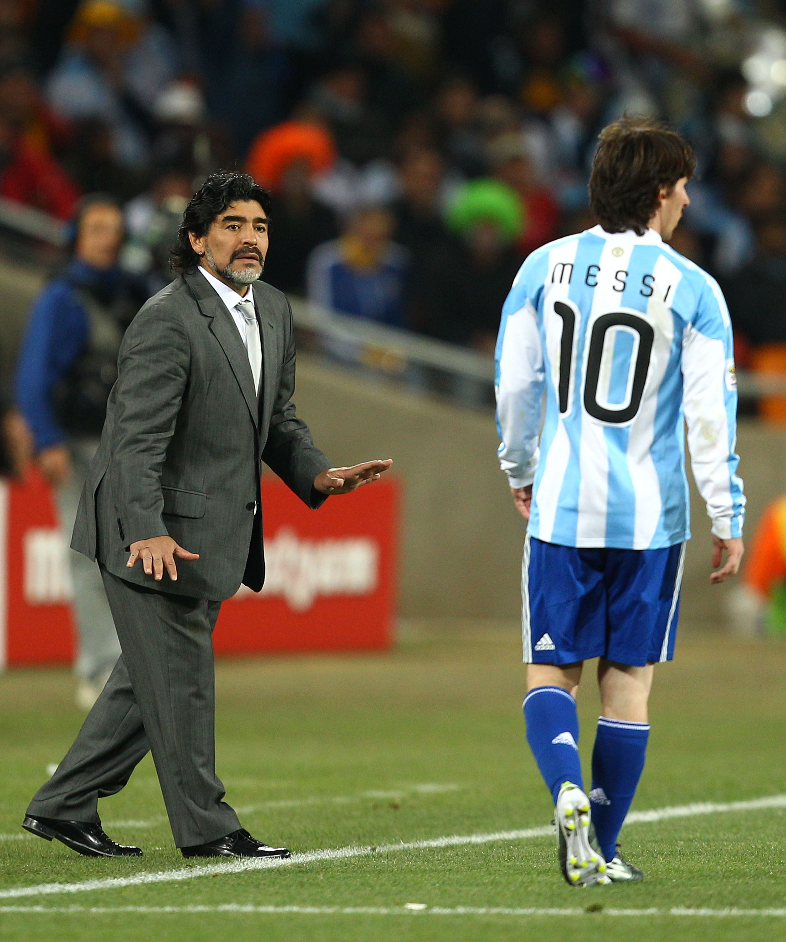 JOHANNESBURG, SOUTH AFRICA - JUNE 27:  Diego Maradona head coach of Argentina gestures to Lionel Messi of Argentina during the 2010 FIFA World Cup South Africa Round of Sixteen match between Argentina and Mexico at Soccer City Stadium on June 27, 2010 in 