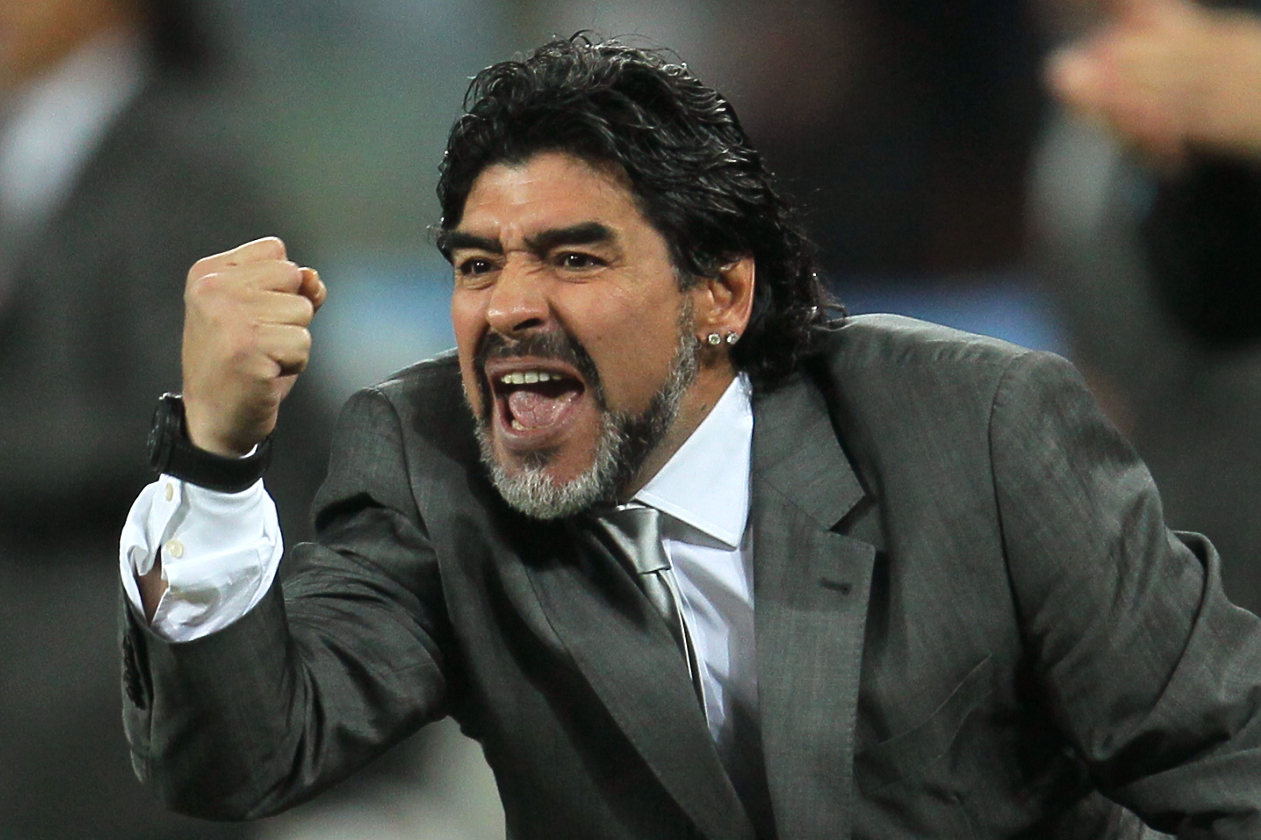 JOHANNESBURG, SOUTH AFRICA - JUNE 27:  Diego Maradona head coach of Argentina celebrates after  Gonzalo Higuain scores his side's second goal during the 2010 FIFA World Cup South Africa Round of Sixteen match between Argentina and Mexico at Soccer City St