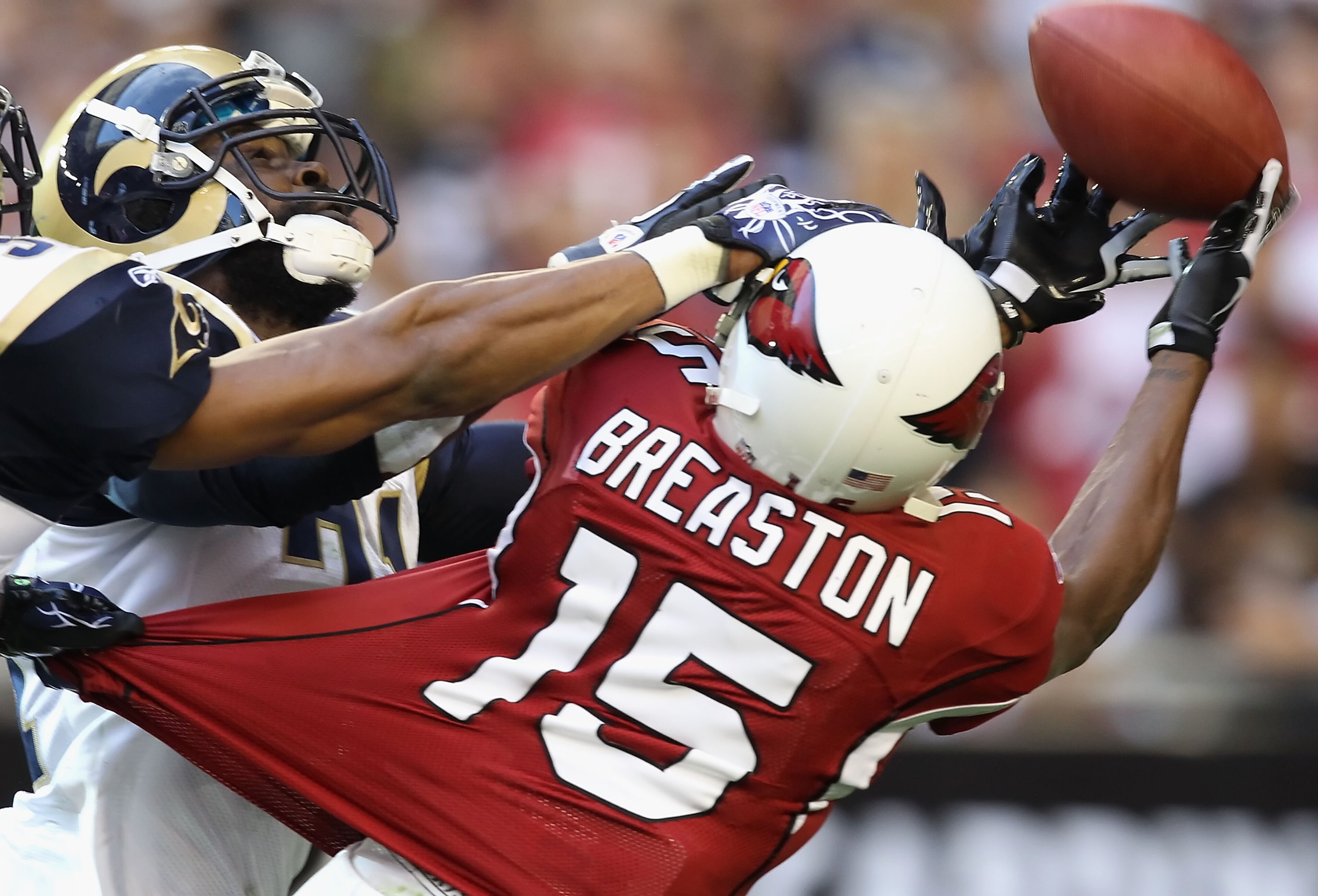 GLENDALE, AZ - DECEMBER 05: Wide receiver Steve Breaston #15 of the Arizona Cardinals is unable to catch a long pass against the St. Louis Rams during the NFL game at the University of Phoenix Stadium on December 5, 2010 in Glendale, Arizona. The Rams de GLENDALE, AZ - DECEMBER 05: Wide receiver Steve Breaston #15 of the Arizona Cardinals is unable to catch a long pass against the St. Louis Rams during the NFL game at the University of Phoenix Stadium on December 5, 2010 in Glendale, Arizona. The Rams de