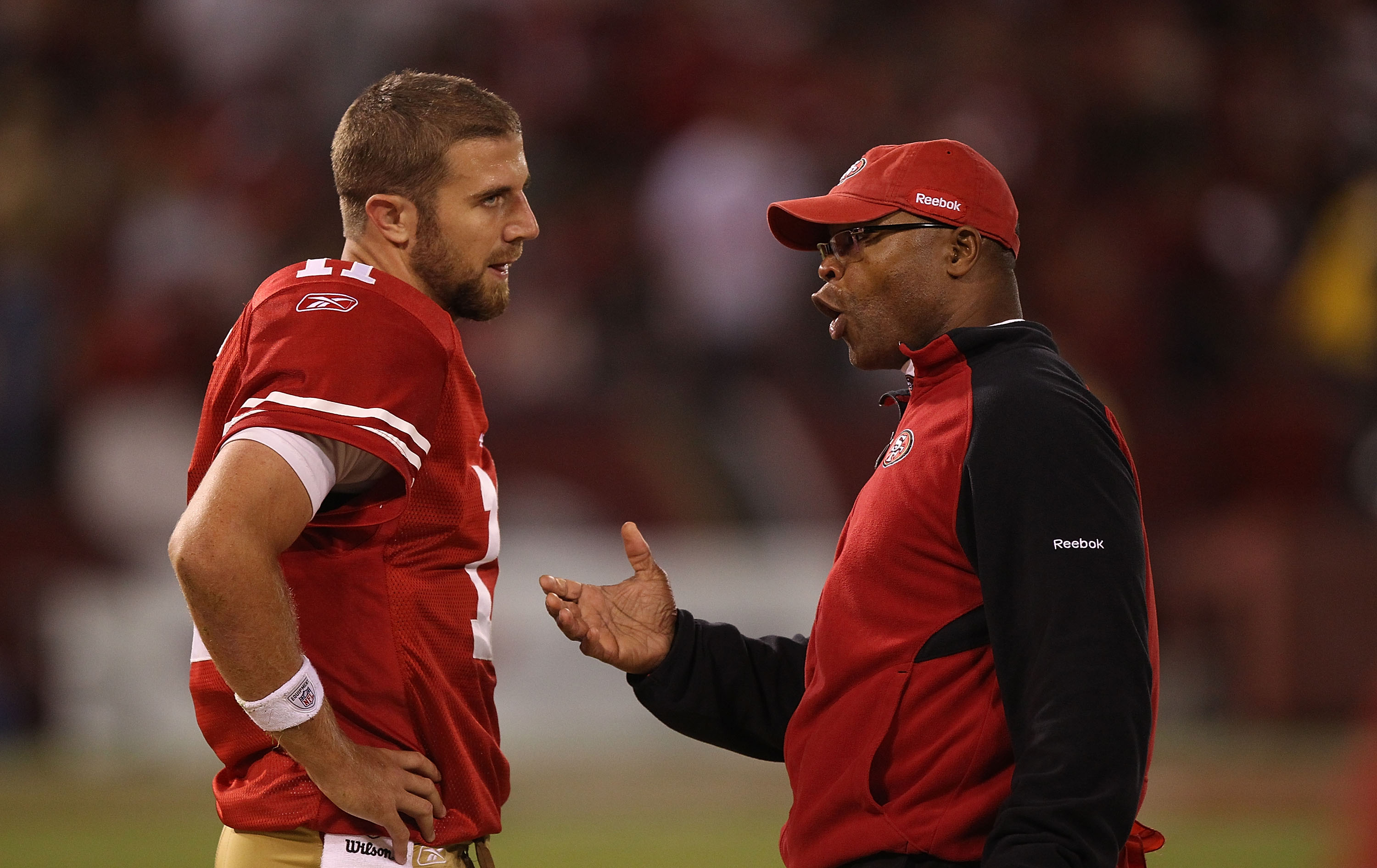 SAN FRANCISCO - OCTOBER 10: Head coach Mike Singletary of the San Francisco 49ers talks with quarterback Alex Smith #11 against the Philadelphia Eagles during an NFL game at Candlestick Park on October 10, 2010 in San Francisco, California. (Photo by Je