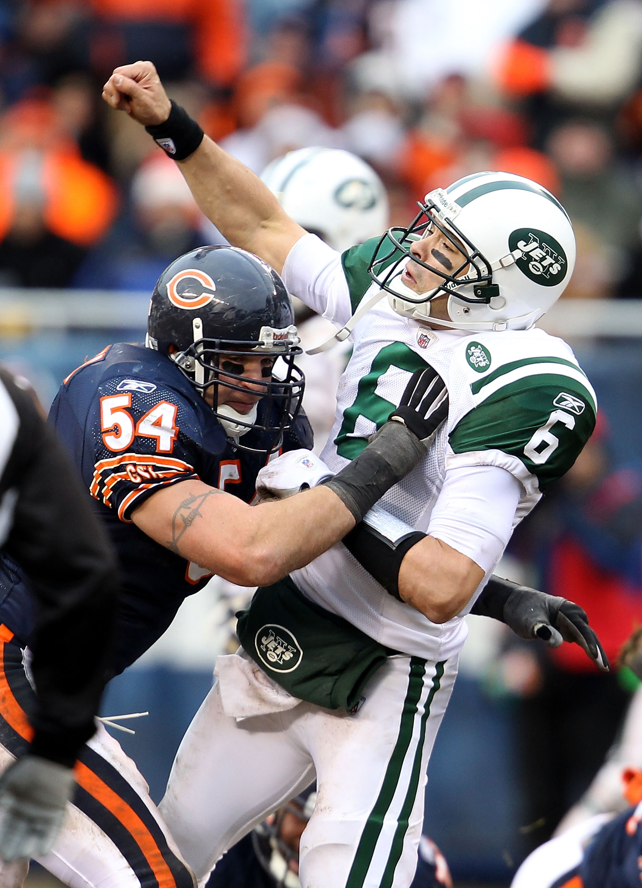 CHICAGO, IL - DECEMBER 26: Brian Urlacher #54 of the Chicago Bears hits Mark Sanchez #6 of the New York Jets at Soldier Field on December 26, 2010 in Chicago, Illinois. The Bears defeated the Jets 38-34. (Photo by Jonathan Daniel/Getty Images)